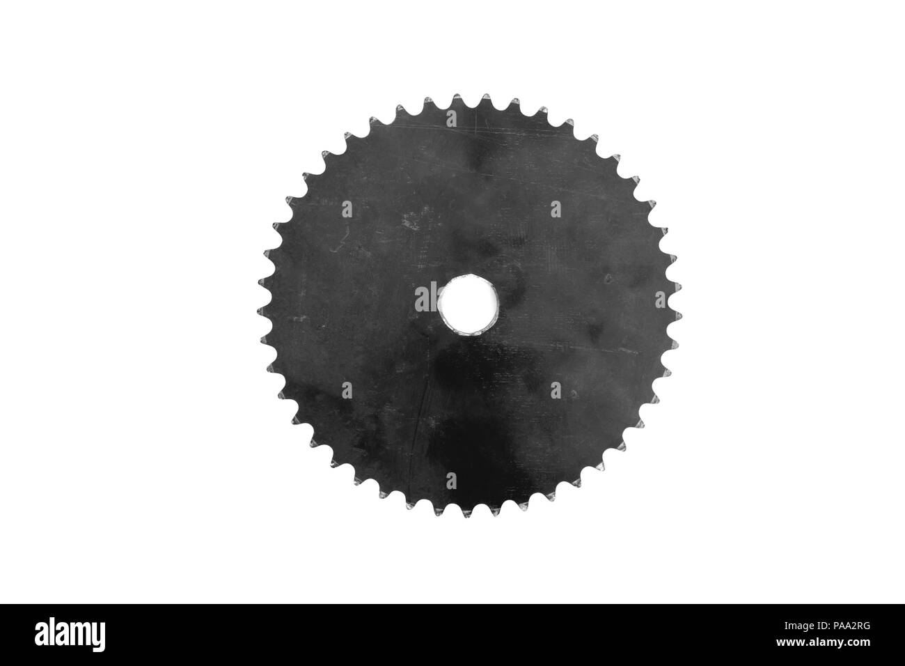 Old and dirty metal gear cog on white background. Black and white tone. Stock Photo