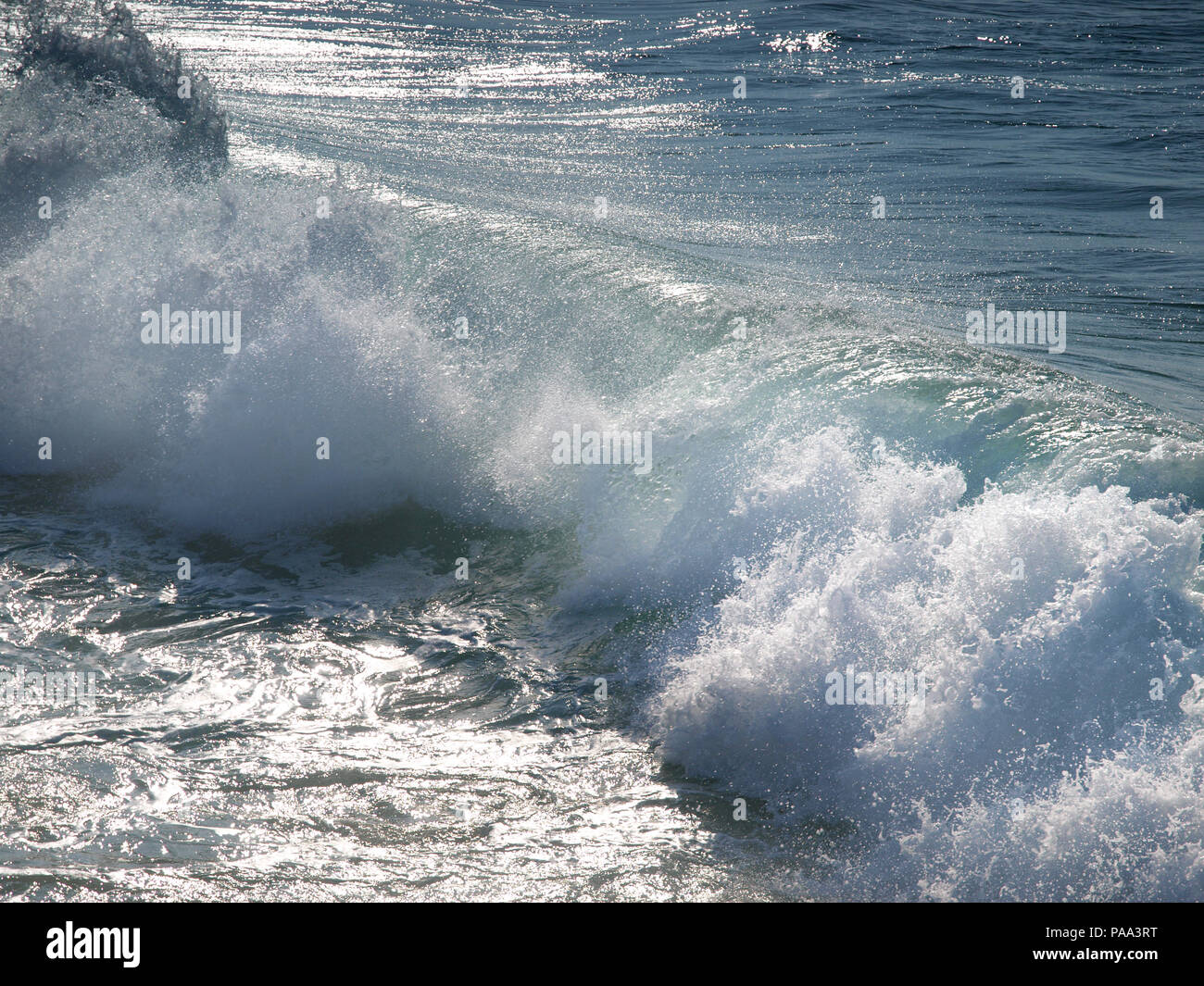 surf rolling in on a beach in northern Spain Stock Photo