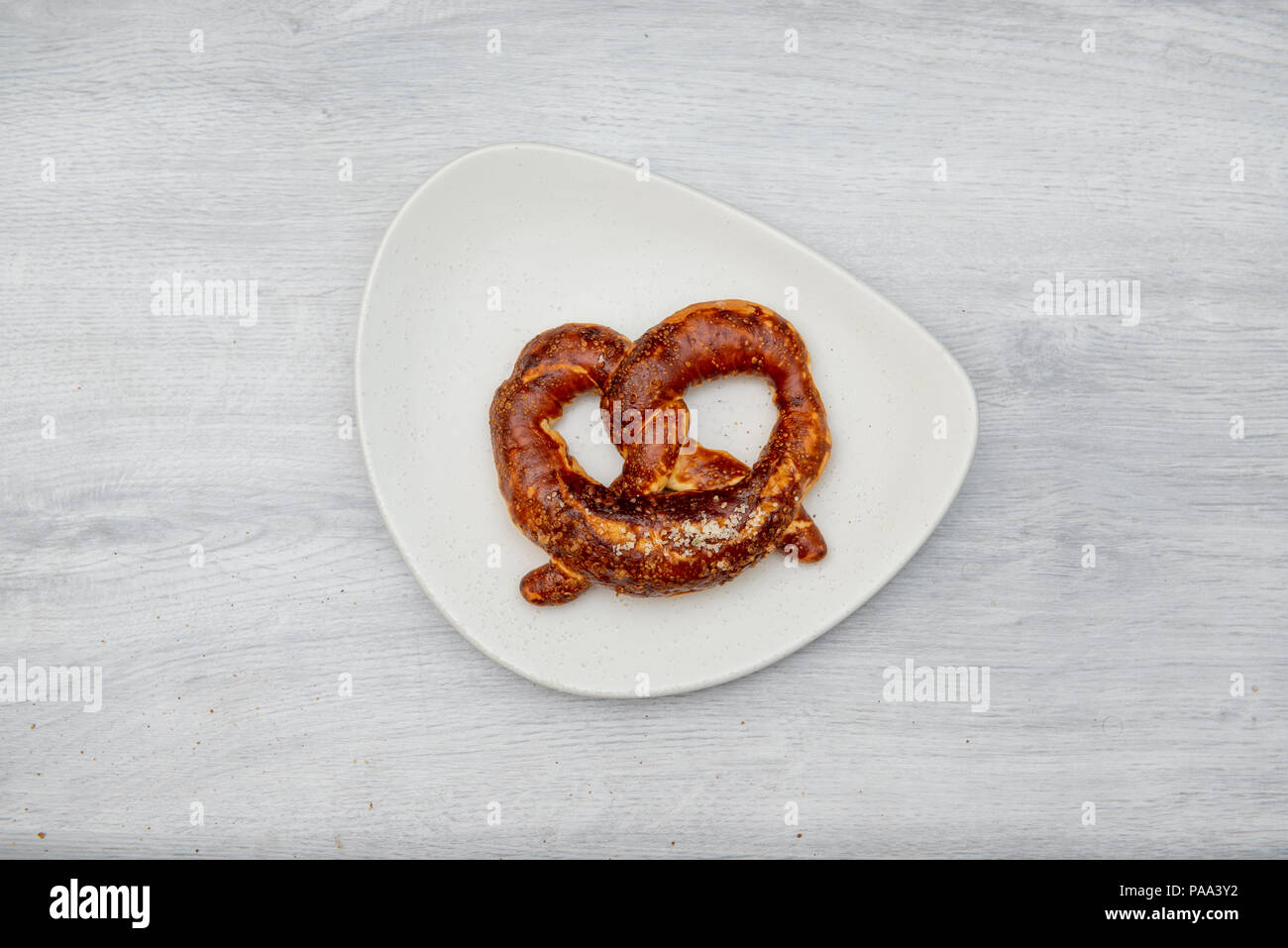 pretzel on white plate Stock Photo