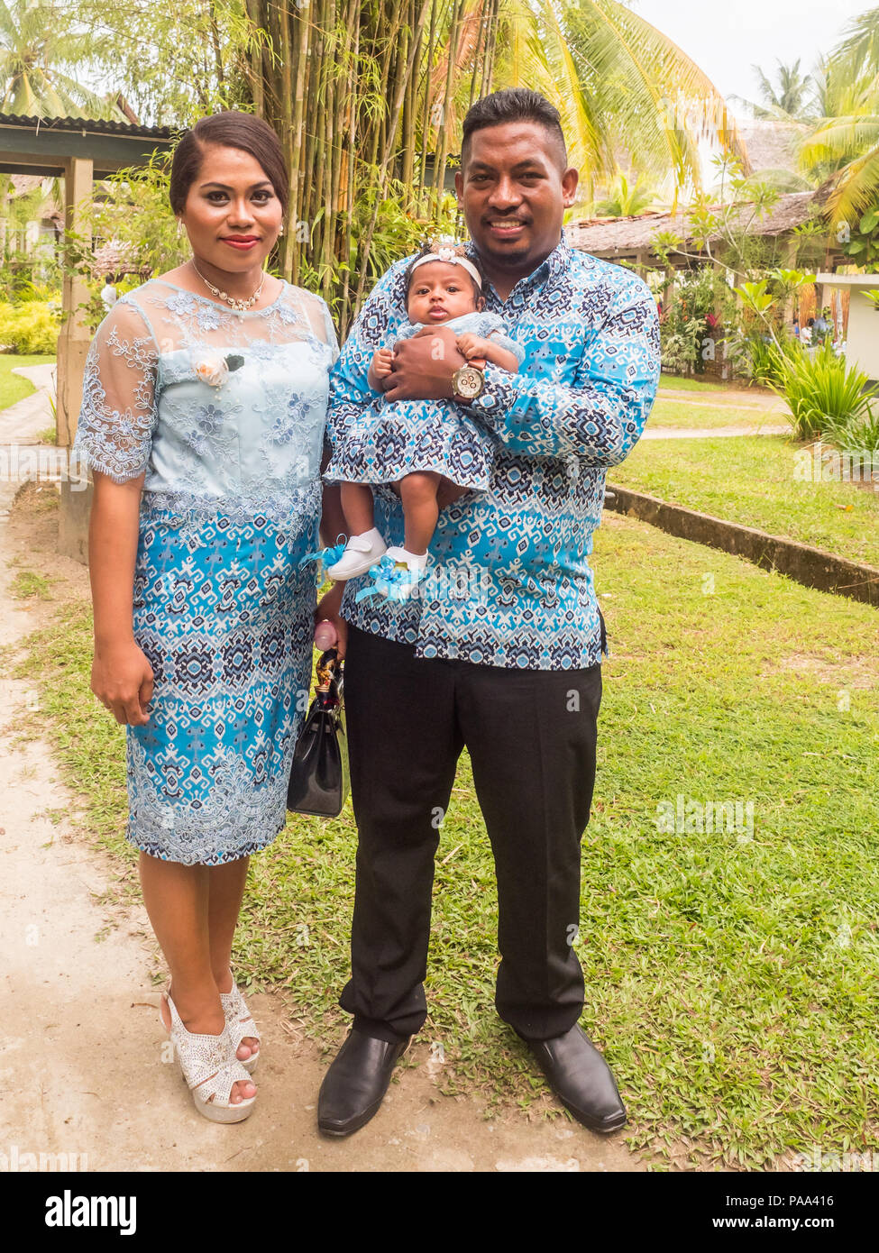 Ambon, Indonesia - February 10, 2018: Portrait of Indonesian family ready for the weeding party at the luxury resort of tropical Island, Ambon, Maluki Stock Photo