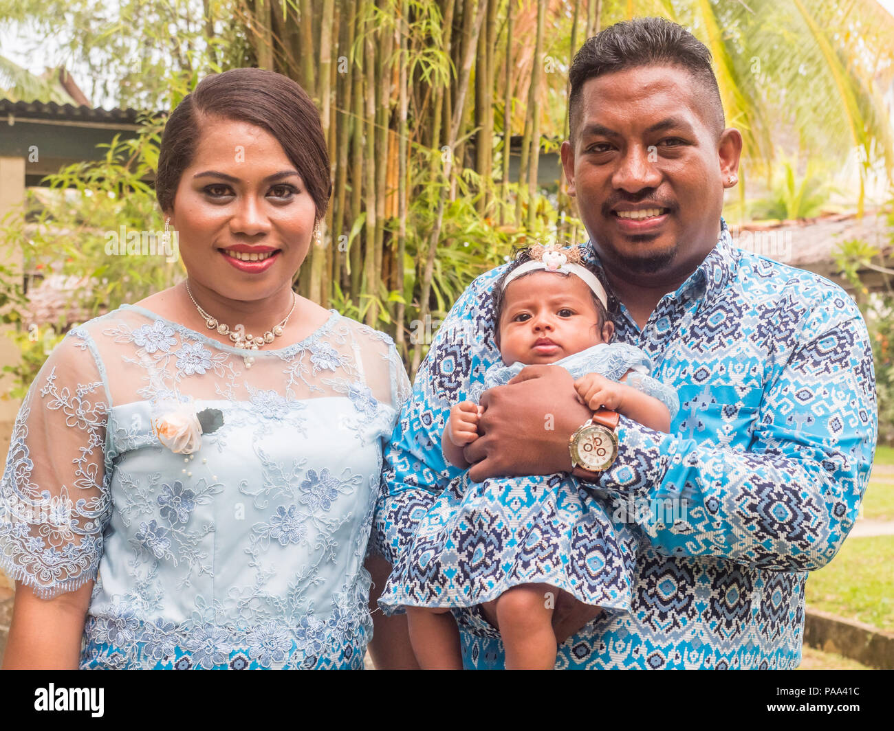 Ambon, Indonesia - February 10, 2018: Portrait of Indonesian family ready for the weeding party at the luxury resort of tropical Island, Ambon, Maluki Stock Photo