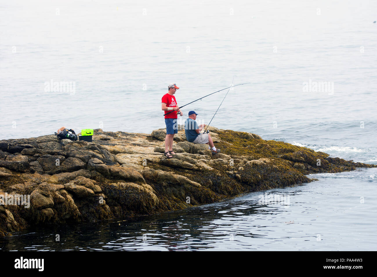 Fishing from the rocks at Ocean Point, Maine, USA Stock Photo