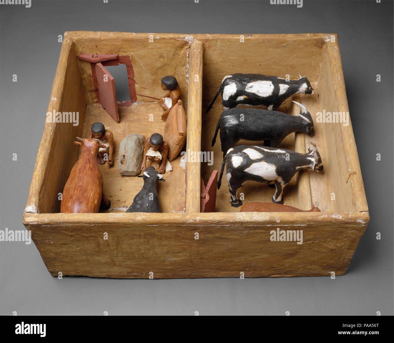 Model Cattle stable from the tomb of Meketre. Dimensions: l. 72.5 cm (28 9/16 in); w. 57 cm (22 7/16 in); h. 28.5 cm (11 1/4 in)  average height of cattle: 18 cm (7 1/16 in.). Dynasty: Dynasty 12. Reign: reign of Amenemhat I, early. Date: ca. 1981-1975 B.C..  This model of a stable was found with twenty three other models of boats, gardens, and workshops in a hidden chamber at the side of the passage leading into the rock cut tomb of the royal chief steward Meketre, who began his career under King Nebhepetre Mentuhotep II of Dynasty 11 and continued to serve successive kings into the early yea Stock Photo