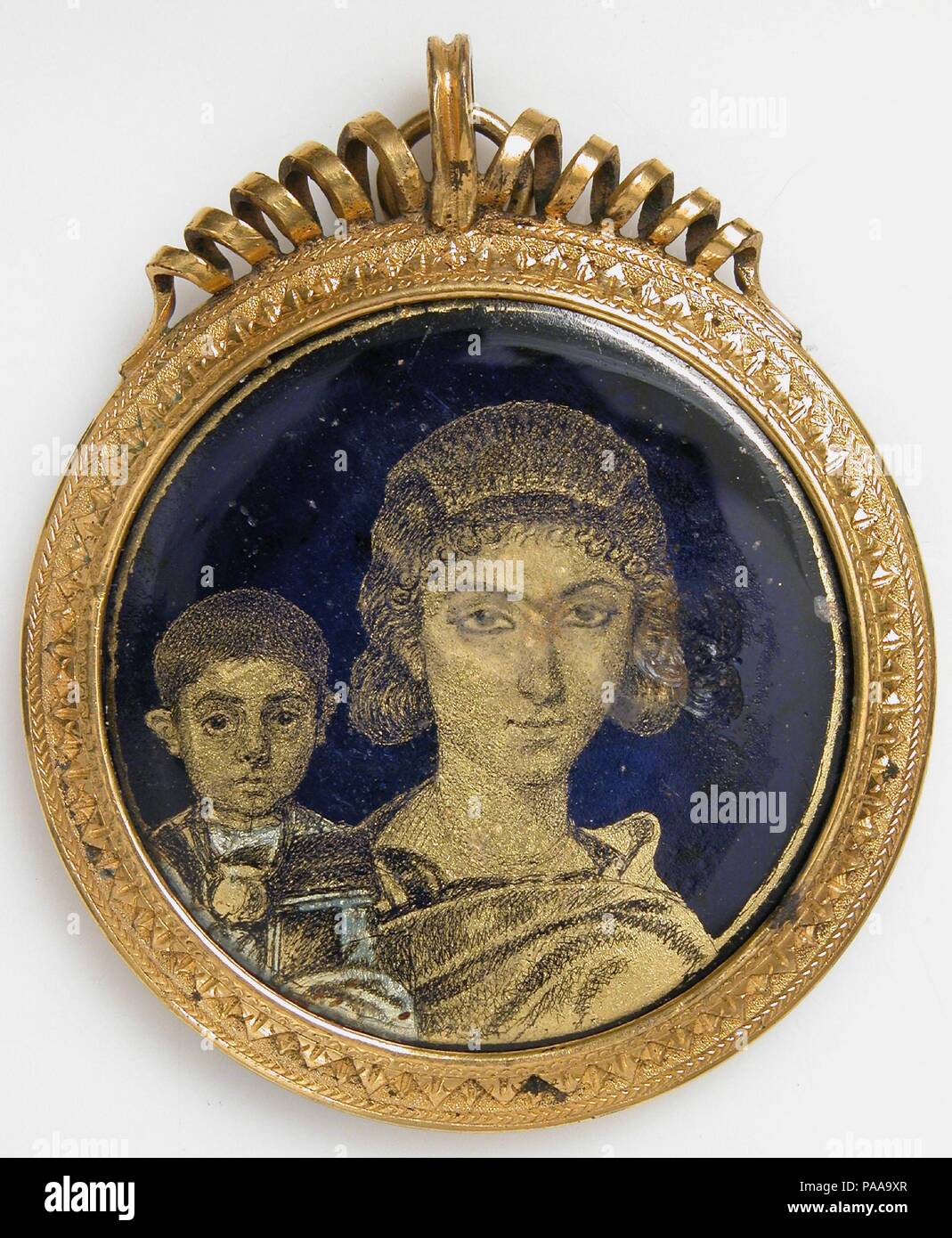 Gold Glass Medallion with a Mother and Child. Culture: Roman. Dimensions: Overall: 1 7/8 x 3/16 in. (4.8 x 0.5 cm). Date: early 4th century.  The mother, a fashionably coiffed matron, is shown with her son. He wears a large gold pectoral, or neck ring. Medallions like this one, meant to be worn as jewelry, are closely associated with Alexandria. Museum: Metropolitan Museum of Art, New York, USA. Stock Photo