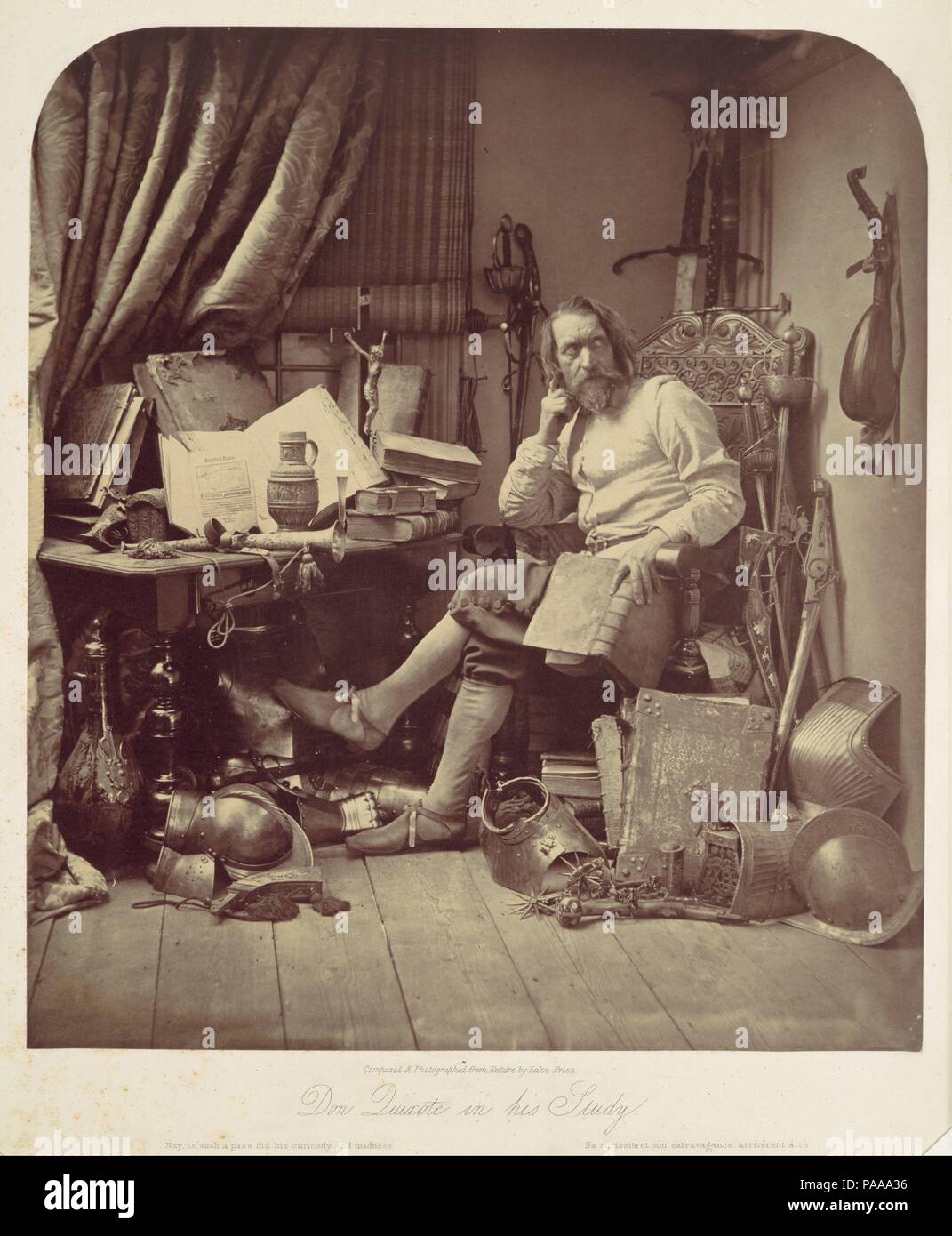 Don Quixote in His Study. Artist: William Frederick Lake Price (British, London 1810-1896 Lee, Kent). Dimensions: Image: 31.9 x 28 cm (12 9/16 x 11 in.)  Mount: 42.6 x 33.3 cm (16 3/4 x 13 1/8 in.). Printer: J. Spencer. Date: 1857.  This carefully staged tableau was among the most widely admired Victorian photographs. Price self-consciously sought to elevate the still-new medium to the level of 'high art' by emulating the ambitious literary subjects, expressive gestures, and period details of grand history painting. Although this approach was largely overshadowed in subsequent years by one tha Stock Photo