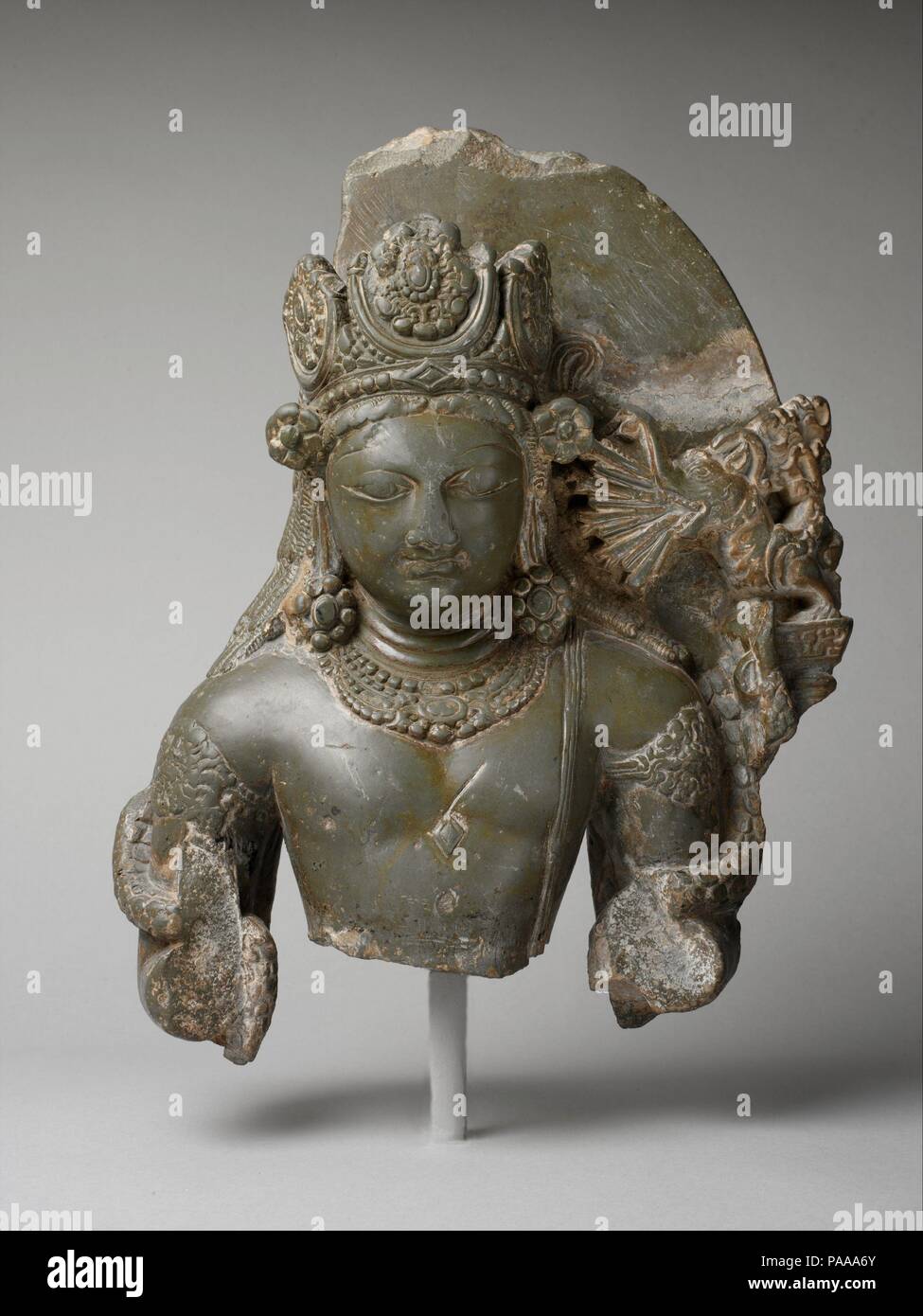 Kamadeva, the God of Love. Culture: India (Jammu and Kashmir, ancient kingdom of Kashmir). Dimensions: H. 14 5/8 in. (37.2 cm); W. 2 3/8 in. (6 cm); D. 11 5/8 in. (29.5 cm). Date: second half of the 8th century.  Though rarely represented in Kashmiri art, Kama, the god of love, is here identified by a wondrous mythical creature (makara), who spews arrows from its jaws. The bow and arrow and a pair of lovebirds are Kamadeva's principal identifiers. This subject is a rare survivor from early medieval Kashmir. Museum: Metropolitan Museum of Art, New York, USA. Stock Photo