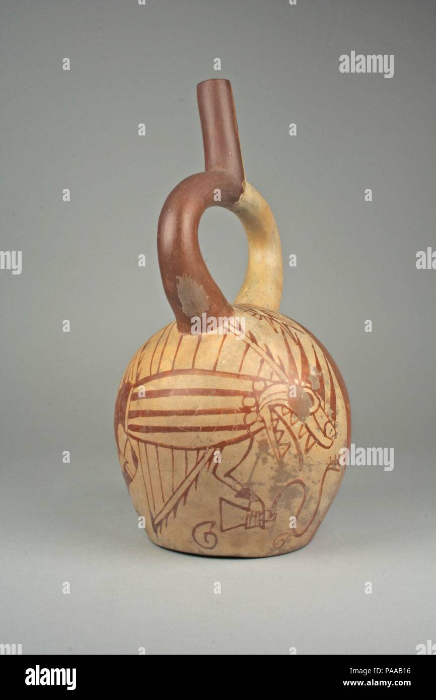 Stirrup spout bottle with fish demon and tumi. Culture: Moche. Dimensions: Overall: 11 in. (27.94 cm)  Other: 5 15/16 in. (15.01 cm). Date: 5th-7th century. Museum: Metropolitan Museum of Art, New York, USA. Stock Photo