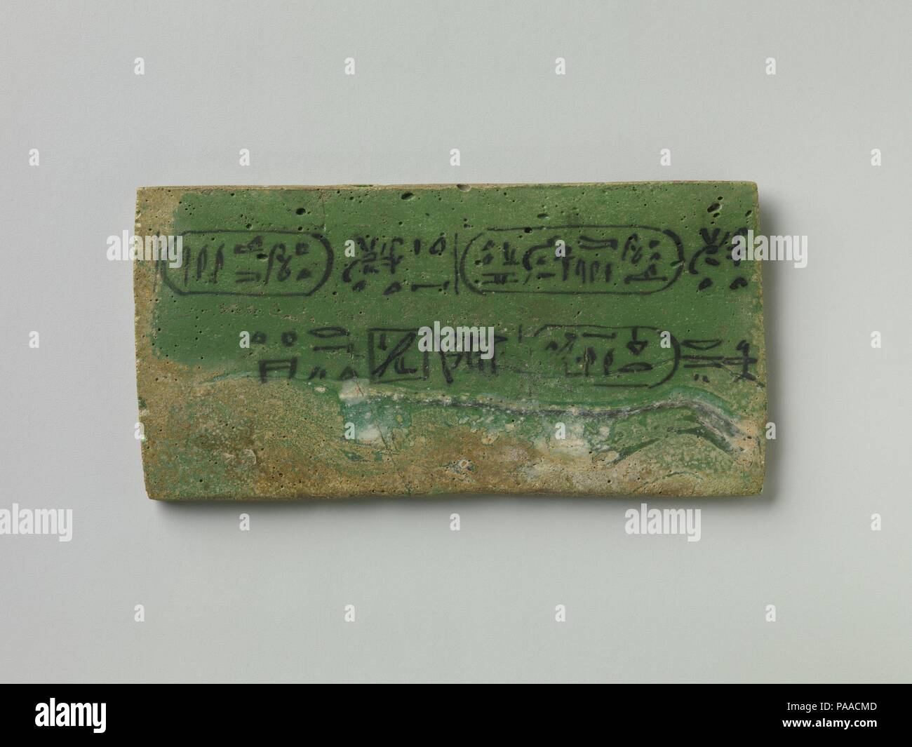 Foundation plaque for a temple dedicated to Hathor / Aphrodite at Cusae. Dimensions: H. 5.3 cm (2 1/16 in.); W. 0.4 cm (3/16 in.); L. 10.6 cm (4 3/16 in.). Dynasty: Ptolemaic Dynasty. Reign: reign of Ptolemy IV Philopator. Date: 222-204 B.C..  This tablet and one or possibly two others in different materials are known from the dedication of a shrine to Aphrodite Urania, in Egyptian 'Hathor Who-is-in-Heaven,' at Cusae by Ptolemy IV. Museum: Metropolitan Museum of Art, New York, USA. Stock Photo