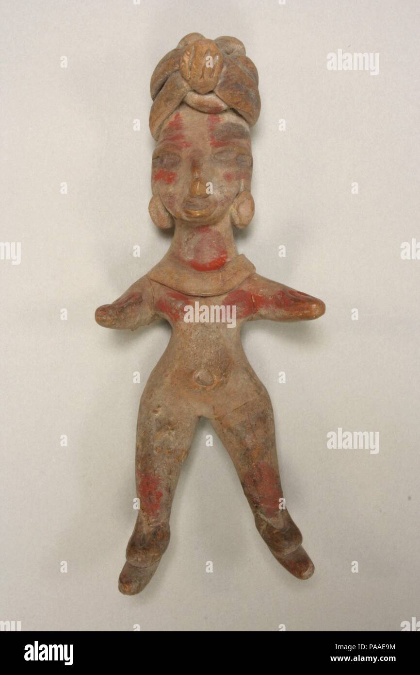 Female Figure. Culture: Tlatilco. Dimensions: H.  5 in. (12.5 cm). Date: 12th-9th century B.C..  This solid, hand-modeled ceramic figurine is buff in color and painted with a red pigment. It is adorned with nose and earplugs, coil necklace, ankle bands, and a tall, wrapped turban with a central ornament. The arms are short and extended forward, while the legs are set apart with the toes pointing downward. Traces of face and body paint are still apparent.   Sculpted some three millennia ago in the Valley of Mexico, this figurine belongs to a group of ceramic effigies known collectively as the T Stock Photo