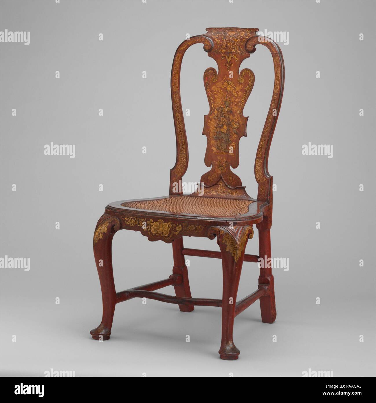 Side chair. Artist: Giles Grendey (1693-1780). Culture: British, Clerkenwell, London. Dimensions: Overall: 41 1/2 × 21 1/2 × 19 3/4 in. (105.4 × 54.6 × 50.2 cm). Date: ca. 1735-40.  The increase in trade between England and the Far East engendered a fascination for things Chinese in the seventeenth and eighteenth centuries. This chair, though made in England, is decorated in imitation of Chinese lacquer, and the central splat bears an image of a mandarin with an umbrella. According to the original label still affixed to the chair, it was made by Giles Grendey of London, who 'makes and sells al Stock Photo