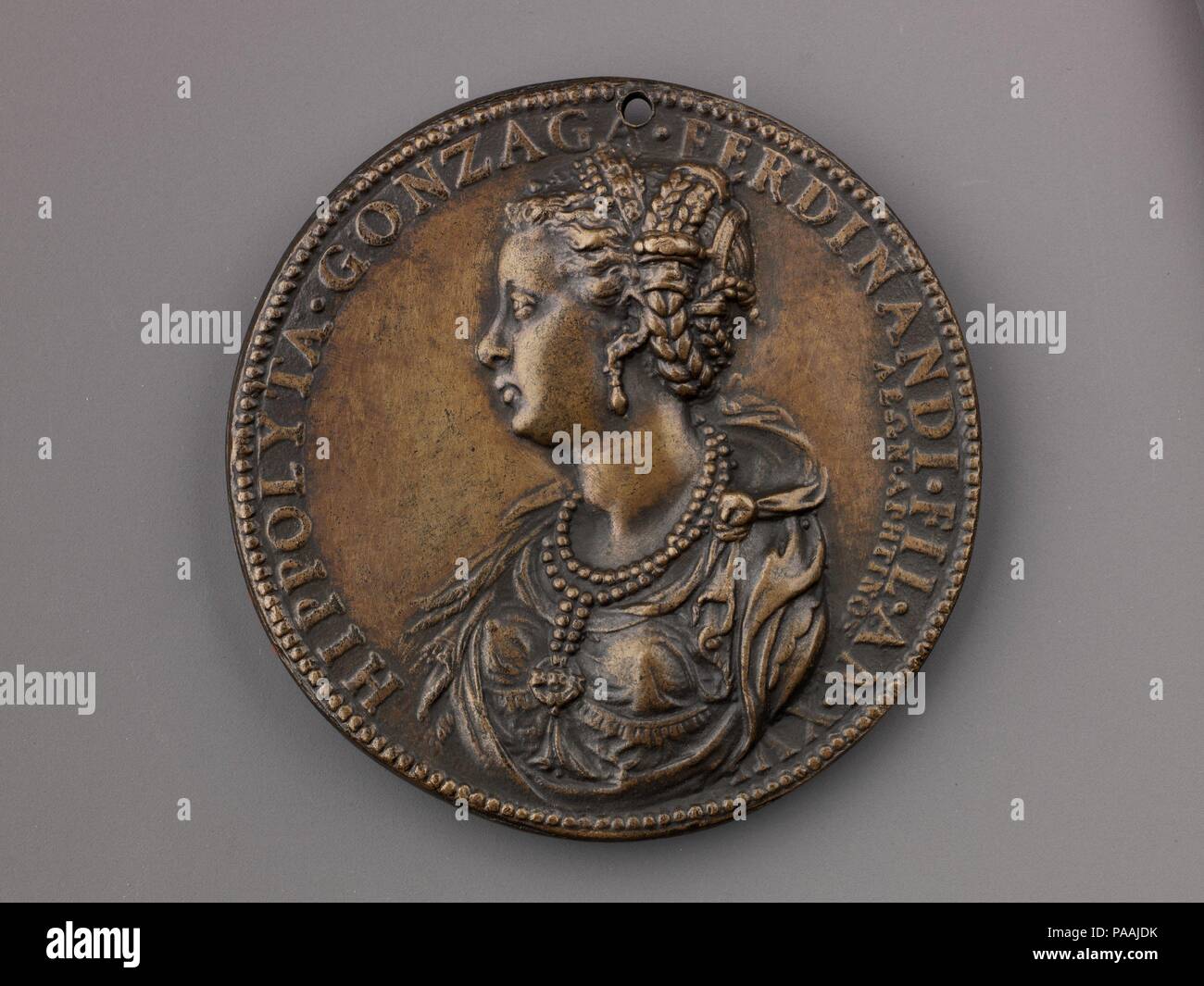 Medal:  Ippolita Gonzaga. Artist: Leone Leoni (Italian, Menaggio ca. 1509-1590 Milan). Dimensions: Diam. 6.6 cm, wt. 75.96 g.. Date: model 1551 (possibly cast 19th century).  On the obverse is a portrait of Ippolita Gonzaga of Mantua (1535 -  1563), wife of Antonio Gonzaga. On the reverse is  Diana, blowing a conch shell and holding a large arrow.  She is accompanied by two of her dogs. Behind her is  Pluto, abducting Proserpina with Cerberus at his feet.  This late aftercast may be from the nineteenth century. Museum: Metropolitan Museum of Art, New York, USA. Stock Photo