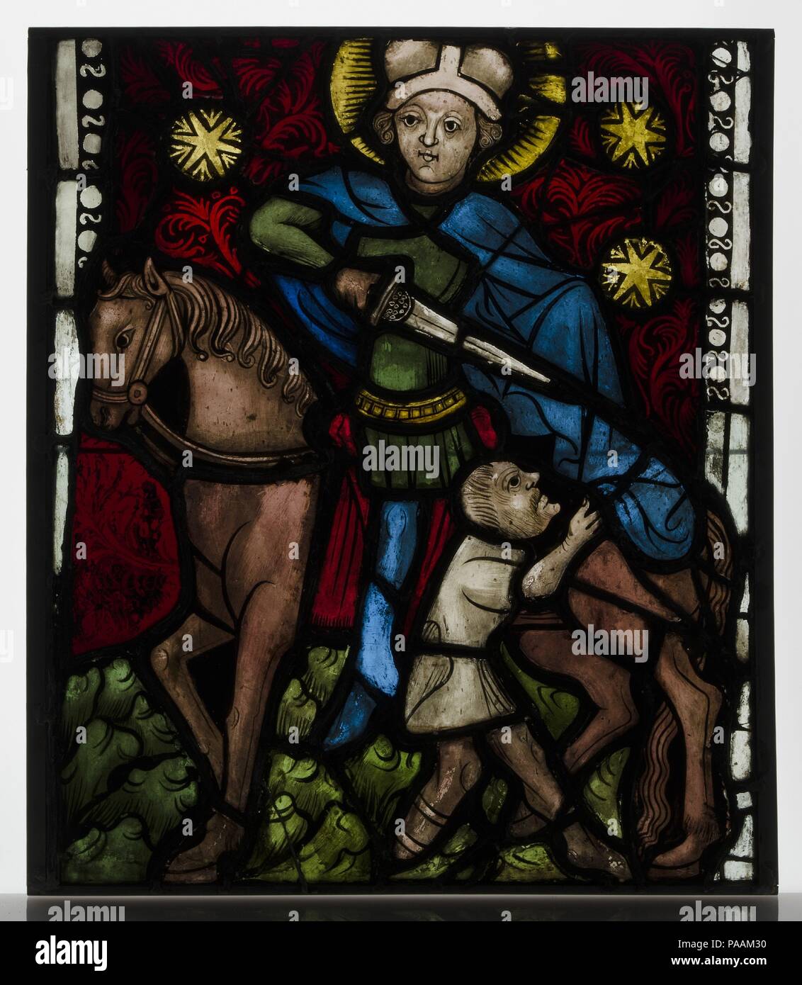 Saint Martin on Horseback Dividing His Cloak. Culture: Austrian. Dimensions: Overall: 20 x 17 in. (50.8 x 43.2 cm). Date: ca. 1410. Museum: Metropolitan Museum of Art, New York, USA. Stock Photo