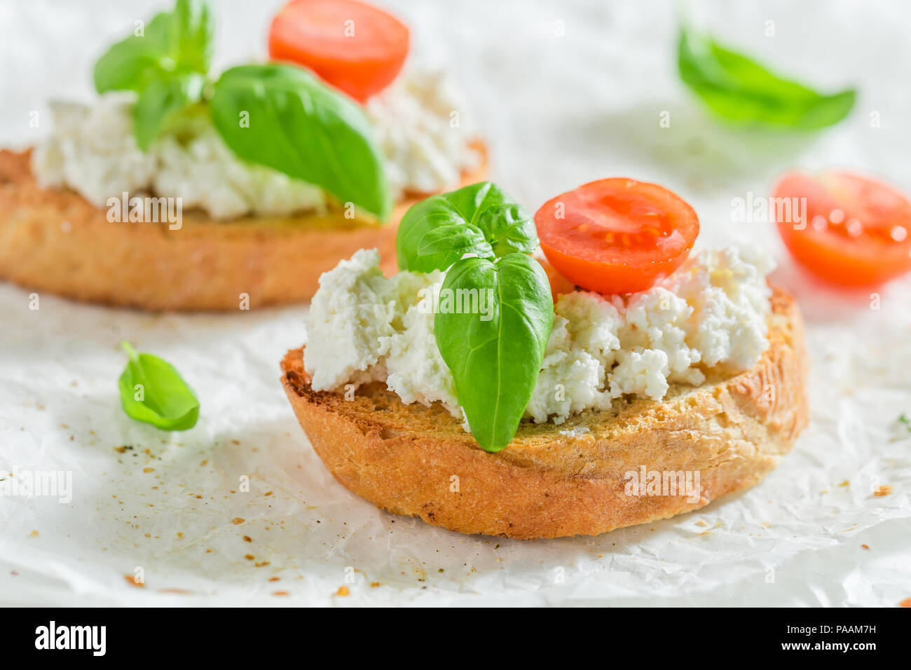 Closeup of bruschetta with ricotta cheese and tomato Stock Photo Alamy