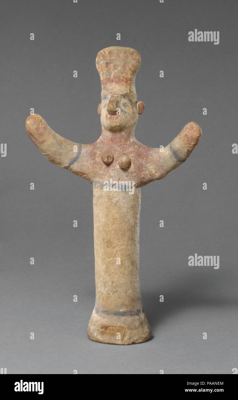 Standing female figurine of the 'goddess with uplifted arms' type. Culture: Cypriot. Dimensions: H. 7 1/4 in. (18.4 cm). Date: ca. 600-480 B.C..  The cylindrical body is handmade and solid.  The entire figure shows considerable remains of paint. Museum: Metropolitan Museum of Art, New York, USA. Stock Photo