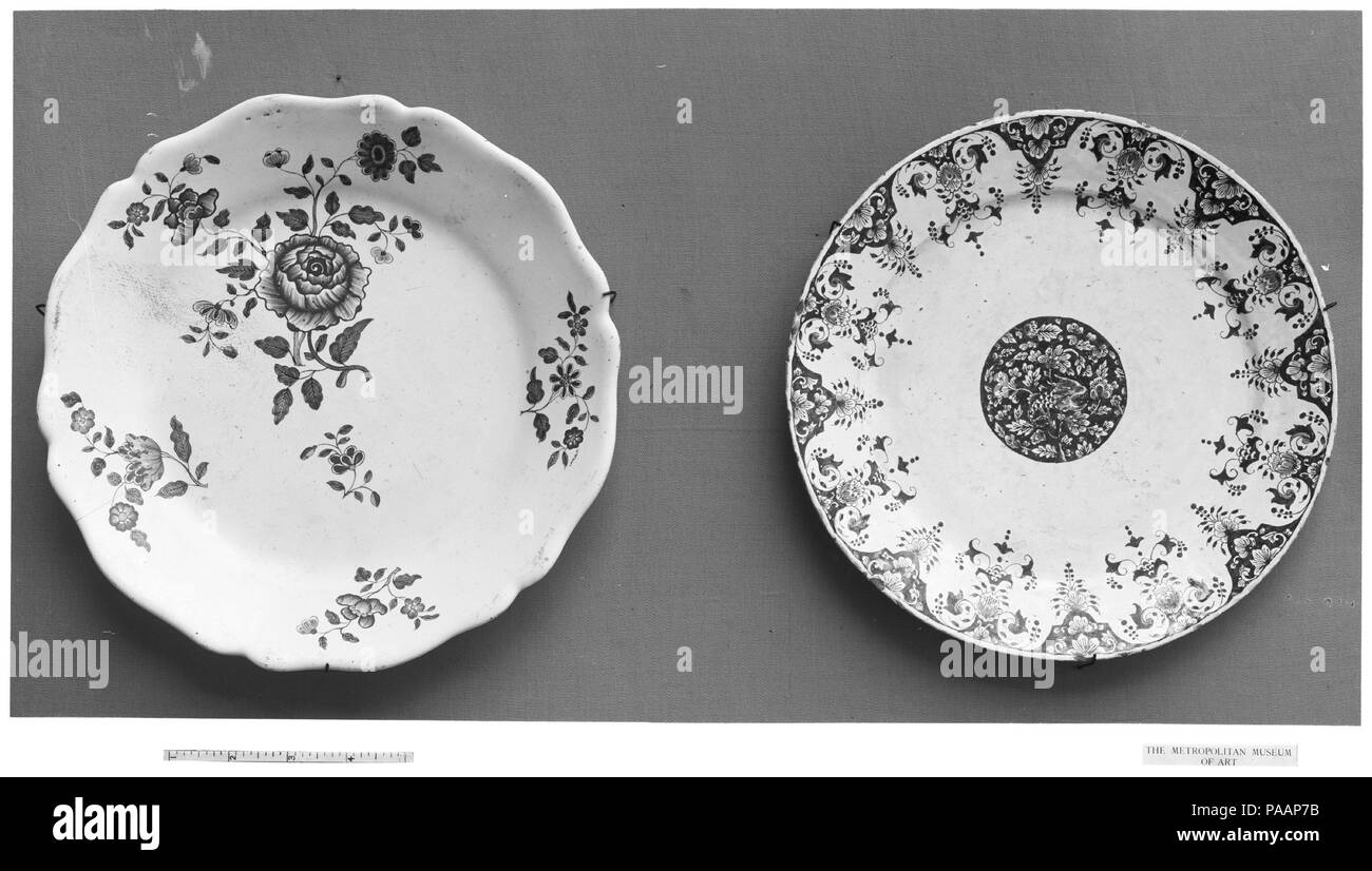 Plate. Culture: French, Rouen. Dimensions: Diameter: 10 in. (25.4 cm). Date: 1720-50.  Faience, or tin-glazed and enameled earthenware, first emerged in France during the sixteenth century, reaching widespread usage among elite patrons during the seventeenth and early eighteenth centuries, prior to the establishment of soft-paste porcelain factories. Although characterized as more provincial in style than porcelain, French faience was used at the court of Louis XIV as part of elaborate meals and displays, with large-scale vessels incorporated into the Baroque garden designs of Versailles. Earl Stock Photo