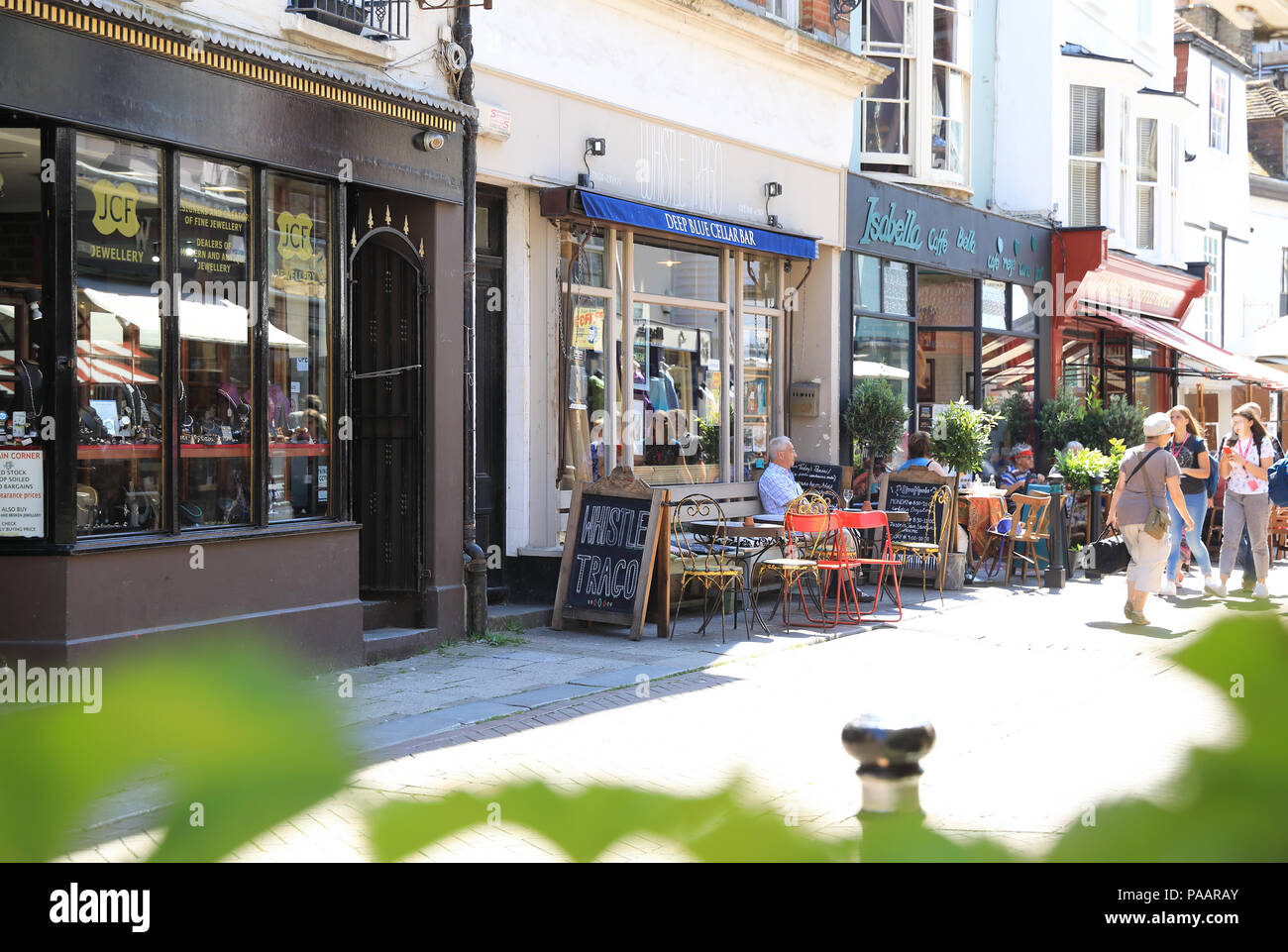 Cafes on vibrant George Street in Hastings Old Town, in East Sussex, UK Stock Photo