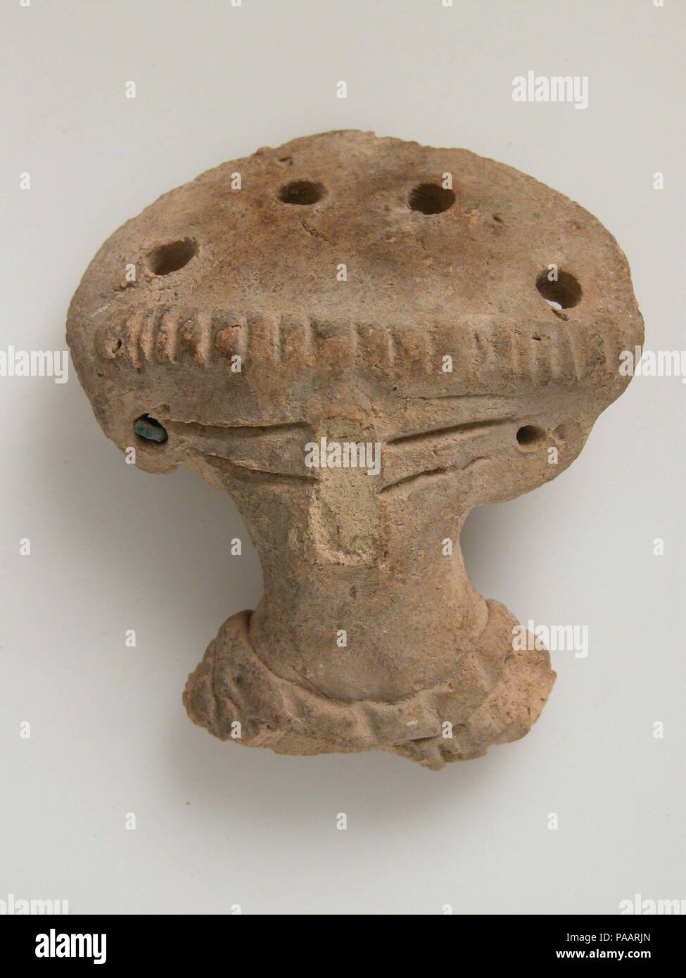 Head. Culture: Coptic. Dimensions: Overall: 2 x 1 3/4 x 13/16 in. (5.1 x 4.5 x 2.1 cm). Date: 4th-7th century. Museum: Metropolitan Museum of Art, New York, USA. Stock Photo