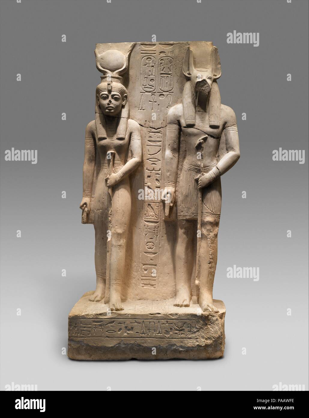 Isis and Wepwawet, god of Asyut,with the name of Siese,Overseer of the Two Granaries of Ramesses II. Dimensions: H. 129 (50 13/16 in); w 64 cm (25 3/16 in); d. 43 cm (16 15/16 in). Dynasty: Dynasty 19. Reign: reign of Ramesses II. Date: ca. 1279-1213 B.C..  The Royal Scribe and Overseer of the Granaries, Siase, dedicated this statue which represents Isis, his patron goddess, and Wepwawet, the local god of Assiut where the statue was made.  Its fine but rather provincial style is the work of sculptors who were somewhat removed from the mainstream of the royal workshops.  However, many of their  Stock Photo
