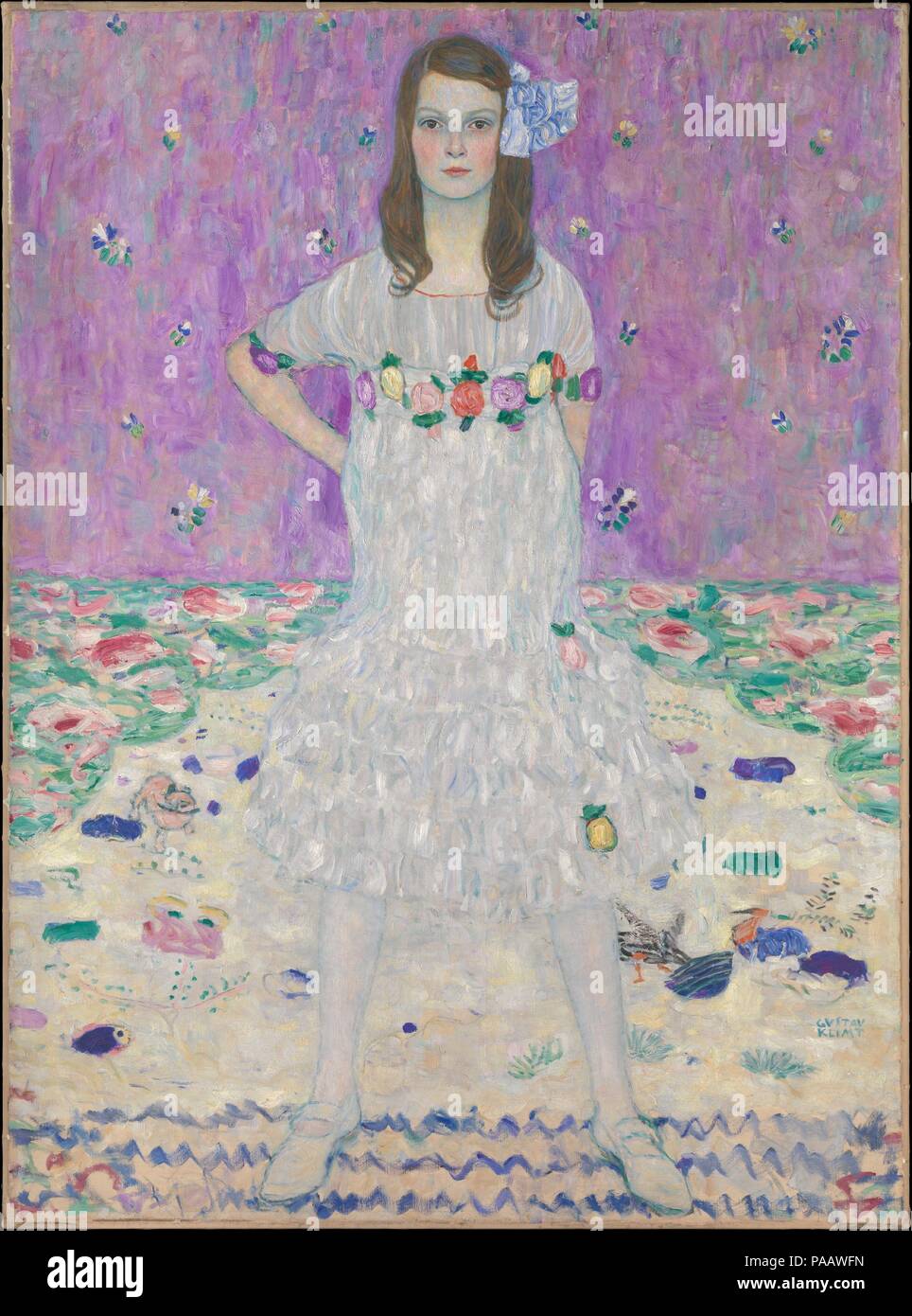 Mäda Primavesi (1903-2000). Artist: Gustav Klimt (Austrian, Baumgarten 1862-1918 Vienna). Dimensions: 59 x 43 1/2 in. (149.9 x 110.5 cm). Date: 1912-13.  Mäda Primavesi's expression and posture convey a remarkable degree of confidence for a nine-year-old girl, even one who was, by her own account, willful and a tomboy. Klimt made numerous preliminary sketches for this portrait, experimenting with different poses, outfits, and backgrounds before deciding to show Mäda standing tall in a specially-made dress amid a profusion of springlike patterns. The picture testifies to the sophisticated taste Stock Photo