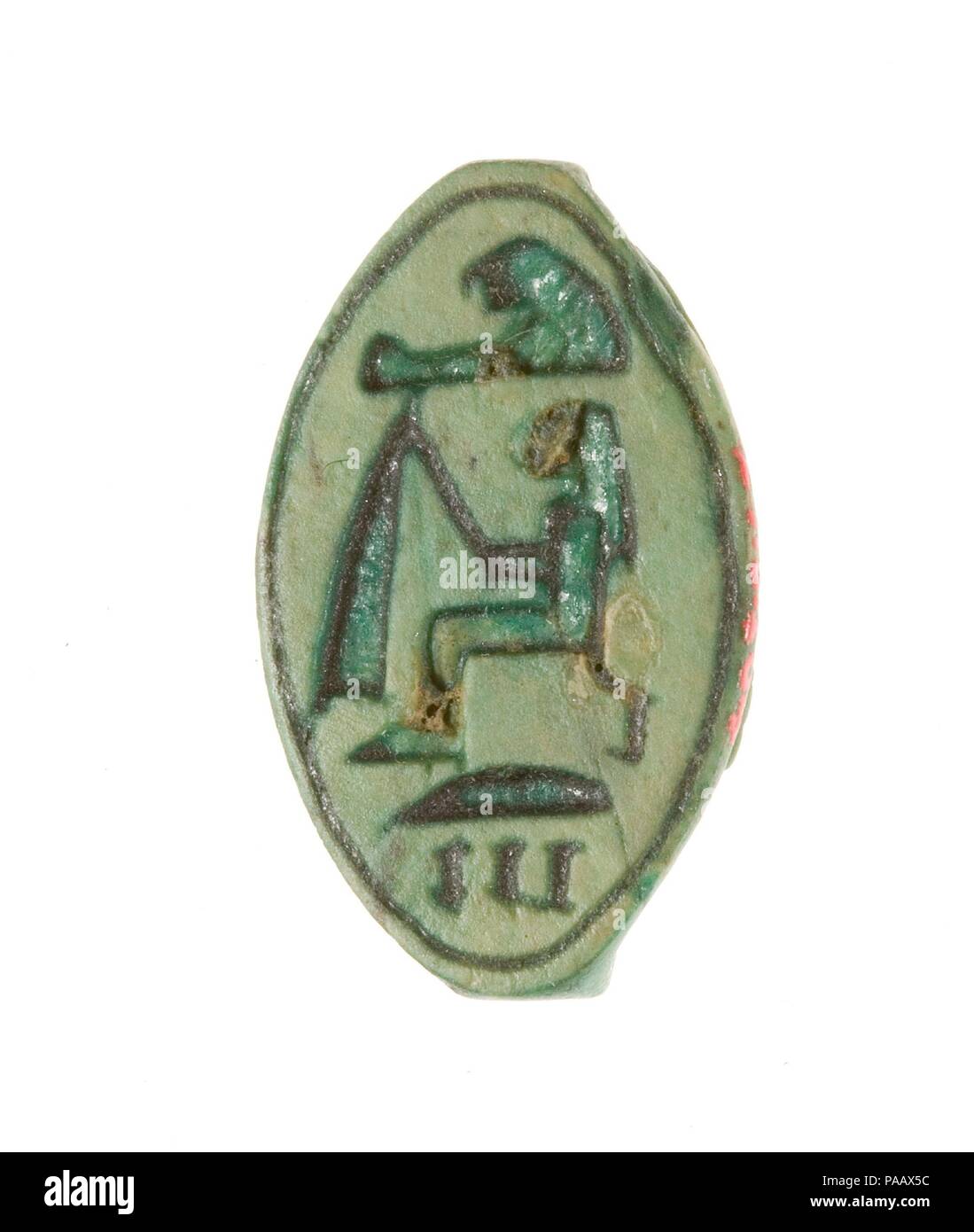 Cowroid Seal Amulet Inscribed with the Name of Hatshepsut. Dimensions: L. 2.2 cm (7/8 in); w. 1.4 cm (9/16 in); h. 0.7 cm (1/4 in). Dynasty: Dynasty 18. Reign: Joint reign of Hatshepsut and Thutmose III. Date: ca. 1479-1458 B.C..  This cowrie-shaped amulet is inscribed with Hatshepsut's personal name which literally means 'foremost of noblewomen' (hat-shepsut). The back of the amulet is decorated with the image of a falcon with its wings outstretched and wearing an atef-crown. Museum: Metropolitan Museum of Art, New York, USA. Stock Photo