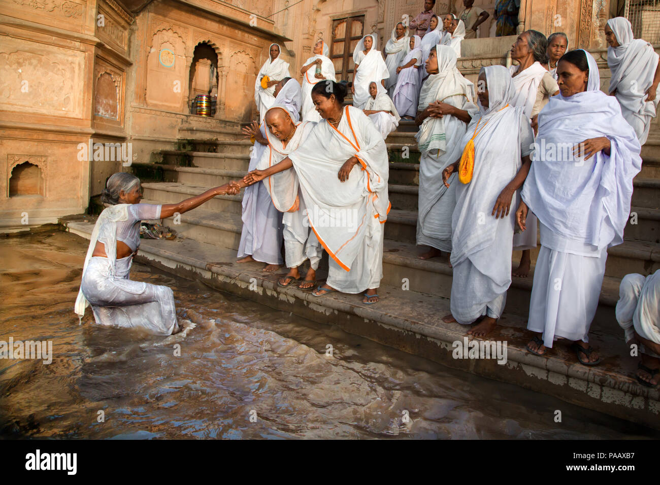Indian Hindu widows on the banks of Yamuna river in Vrindavan , India Stock Photo