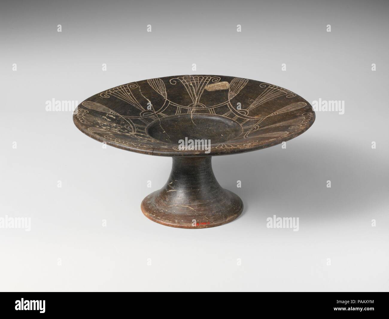 Terracotta stemmed plate. Culture: Capenate. Dimensions: H. 3 5/16