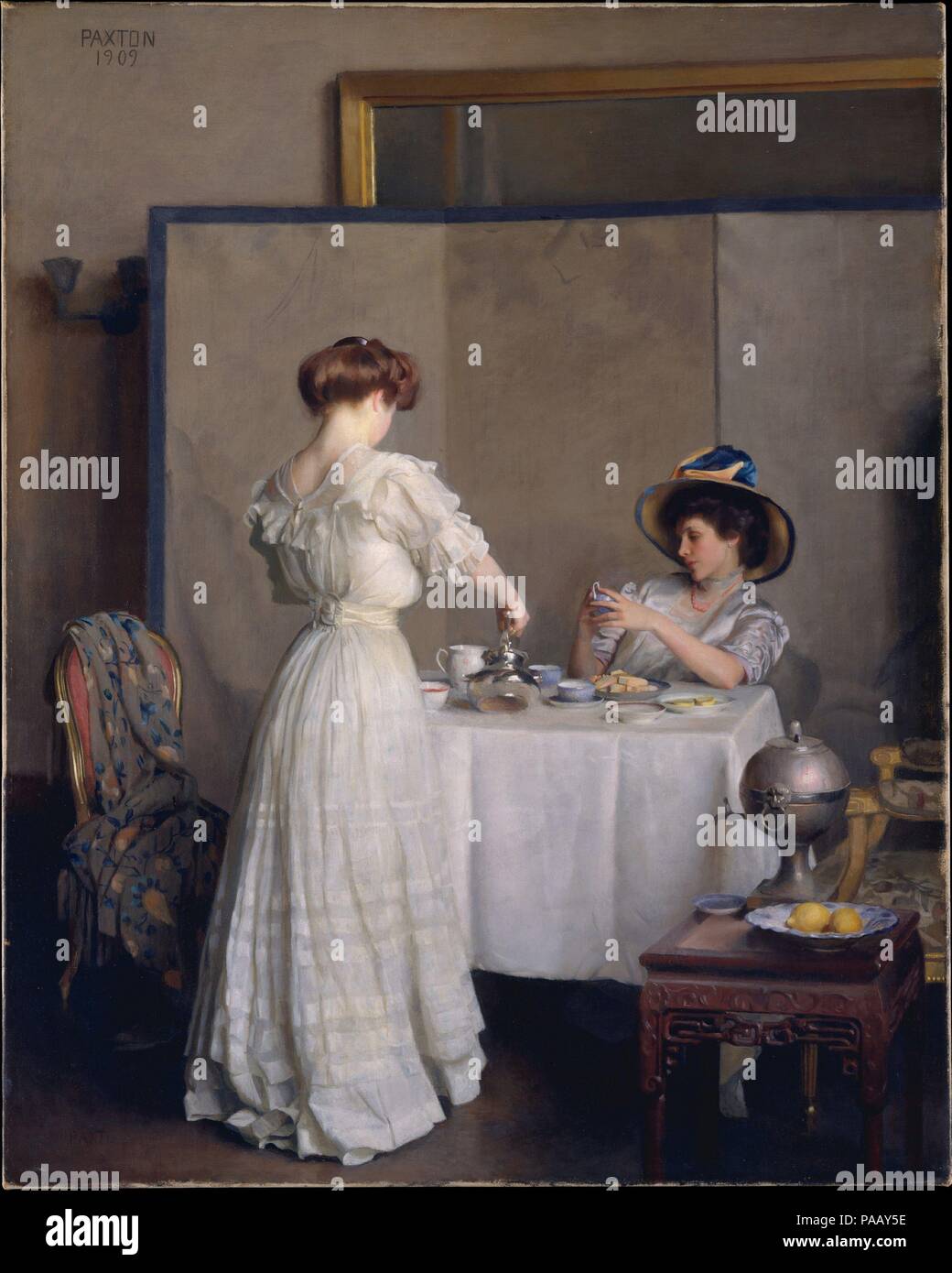 Tea Leaves. Artist: William McGregor Paxton (American, Baltimore, Maryland 1869-1941 Boston, Massachusetts). Dimensions: 36 1/8 x 28 3/4 in. (91.6 x 71.9 cm). Date: 1909.  Paxton often depicted refined women--such as his patrons' wives and daughters--at leisure in handsome Boston interiors of the sort they would have decorated and occupied. By equating women with the precious aesthetic trappings that surrounded them, Paxton echoed the spirit of the novelist Henry James, who portrayed women as collectible objects in novels such as Portrait of a Lady (1881). Paxton's restrained palette and preci Stock Photo