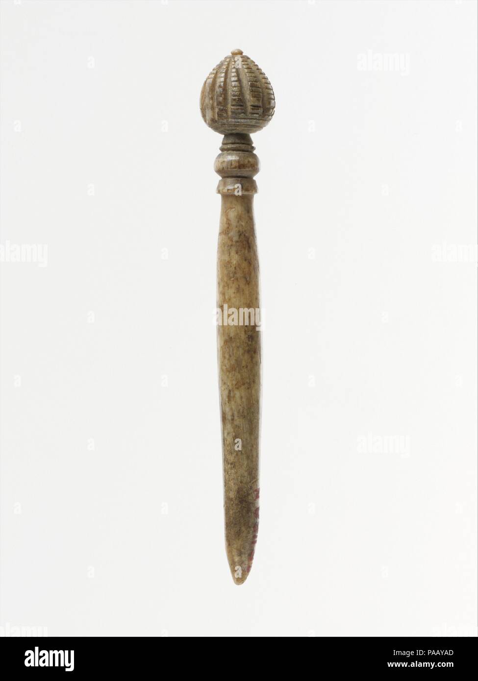 Bone pin. Culture: Roman. Dimensions: H.: 2 3/8 in. (6 cm). Date: ca. A.D. 300-450.  Similar pins found in excavations in Rome have been dated to the late Roman period (4th-5th century A.D.). Museum: Metropolitan Museum of Art, New York, USA. Stock Photo