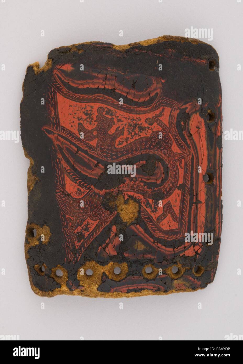 Element from a Lacquered Leather Armor (jia). Culture: Yi or Nuosu, China (Yunnan or Sichuan). Dimensions: H. 5 1/8 inches (13 cm); W. 6 3/4 inches (17.1 cm). Date: 900-1400. Museum: Metropolitan Museum of Art, New York, USA. Stock Photo