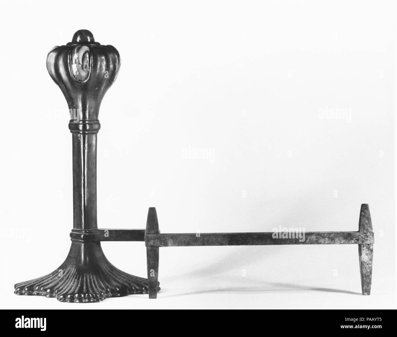 Andiron. Culture: American. Designer: Designed by Louis Comfort Tiffany (American, New York 1848-1933 New York). Dimensions: 25 x 15 x 35 in. (63.5 x 38.1 x 88.9 cm). Maker: Tiffany Glass and Decorating Company (American, 1892-1902). Date: 1894.  In 1894, Emily Johnston de Forest and her husband, Robert W. de Forest, who served as president of The Metropolitan Museum of Art from 1913 to 1931, renovated their New York residence at Seven Washington Square and commissioned Louis C. Tiffany to decorate the interior of the library addition. Tiffany was a close friend and distant relative of de Fore Stock Photo