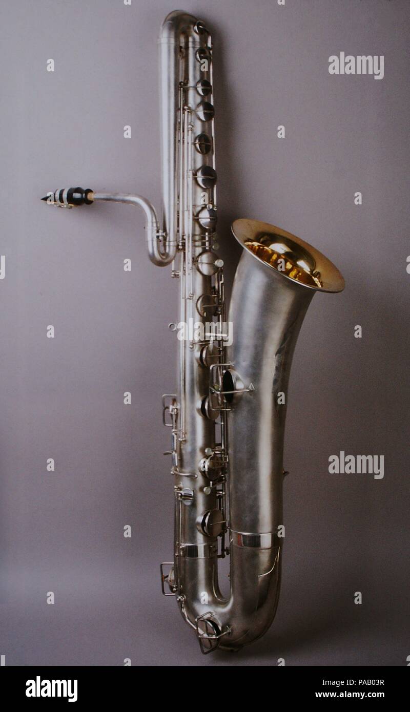 Bass saxophone in B-flat. Culture: American. Dimensions: L. 132.5 cm (51 3/4 in.). Maker: Elkhart Band Instrument Co. (ca. 1923-1928) successors to Ferdinand August Buescher. Date: ca. 1923-28.  Although saxophones were conceived as a family of instruments, as seen in Adolphe Sax's 1846 patent, the bass was the first to be made. The saxophone family typically ranges from sopranino to contrabass.  Bass saxophones were especially popular in jazz and dance bands between the First and Second World Wars.  Buescher was the first company to make saxophones in the United States. Museum: Metropolitan M Stock Photo