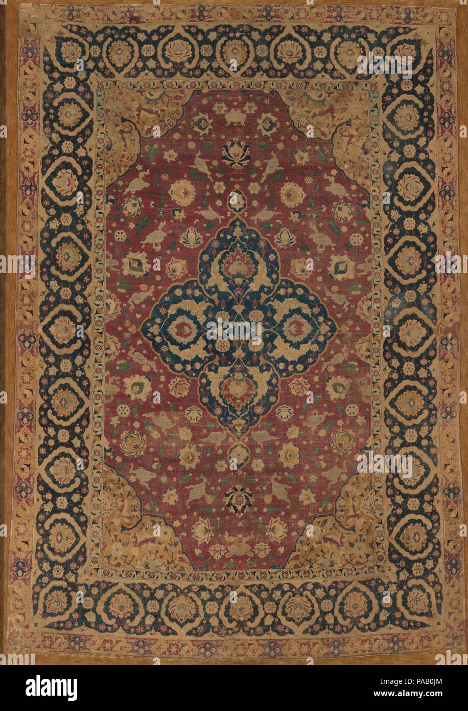 https://c8.alamy.com/comp/PAB0JM/silk-kashan-carpet-dimensions-mount-dimensions-l-105-12-in-268-cm-w-76-12-in-1943-cm-weight-in-mount-555-lbs-2517-kg-date-second-half-16th-century-this-carpet-possibly-woven-in-the-silk-trade-and-carpet-manufacturing-center-of-kashan-has-a-dark-blue-quatrefoil-medallion-at-its-center-decorative-elements-on-this-and-other-related-carpets-from-kashan-and-tabriz-indicate-that-weavers-may-have-used-pattern-books-containing-popular-motifs-to-guide-them-in-production-these-designs-are-also-present-in-other-media-particularly-in-the-arts-of-the-book-the-use-of-metal-wrap-PAB0JM.jpg
