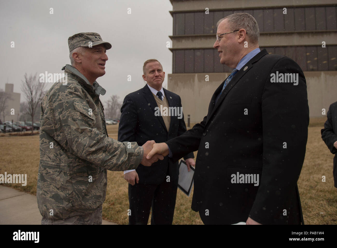 Deputy Secretary of Defense Bob Work says goodbye to Maj. Gen. Thomas J. 'Tom' Masiello, commander, Air Force Research Laboratory as he prepares to depart Wright-Patterson Air Force Base, Ohio, after touring the base and speaking to a group of students from the local Dayton, Ohio, area during 'Week at the Labs' event March 3, 2016. (Photo by Senior Master Sgt. Adrian Cadiz/Released) Stock Photo