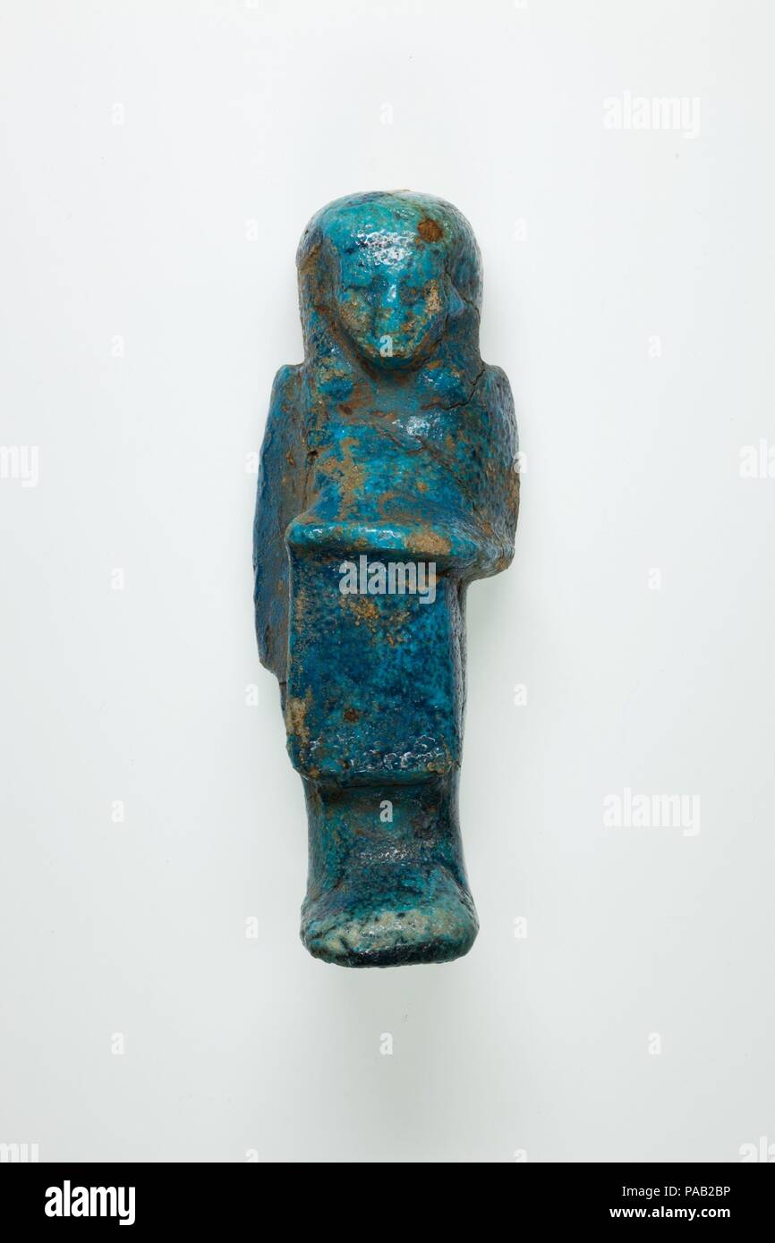 Overseer Shabti of Henettawy (C), Daughter of Isetemkheb. Dimensions: h. 11.7 × w. 4.3 × d. 3.6 cm (4 5/8 × 1 11/16 × 1 7/16 in.). Dynasty: Dynasty 21. Date: ca. 990-970 B.C.. Museum: Metropolitan Museum of Art, New York, USA. Stock Photo