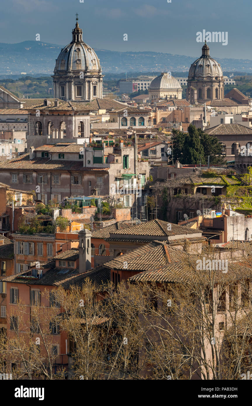 Rome rooftops with the domes of Sant Andrea della Valle, Chiesa di San Carlo e Biagio ai Catinari, and the Great Synagogue of Rome Stock Photo