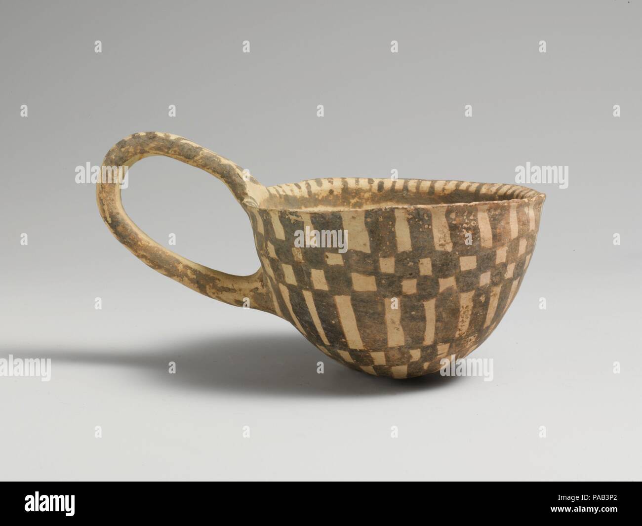 Terracotta loop-handled cup. Culture: Cypriot. Dimensions: H. 2 3/16 in ...