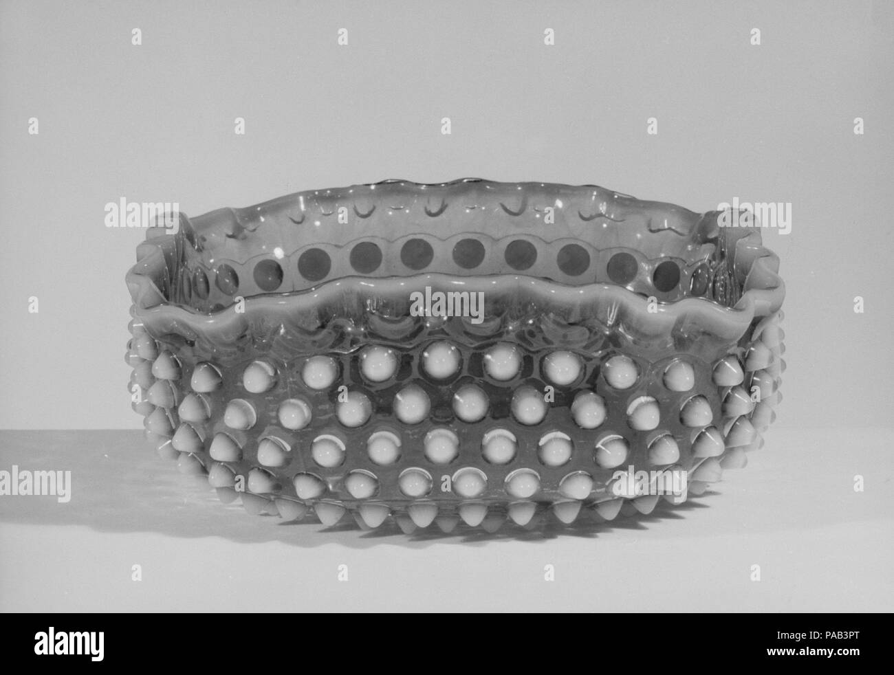Hobnail Fruit Bowl. Culture: American. Dimensions: H. 3 1/4 in. (8.3 cm); Diam. 8 1/4 in. (21 cm). Maker: Probably Hobbs, Brockunier and Company (1863-1891). Date: after 1886. Museum: Metropolitan Museum of Art, New York, USA. Stock Photo