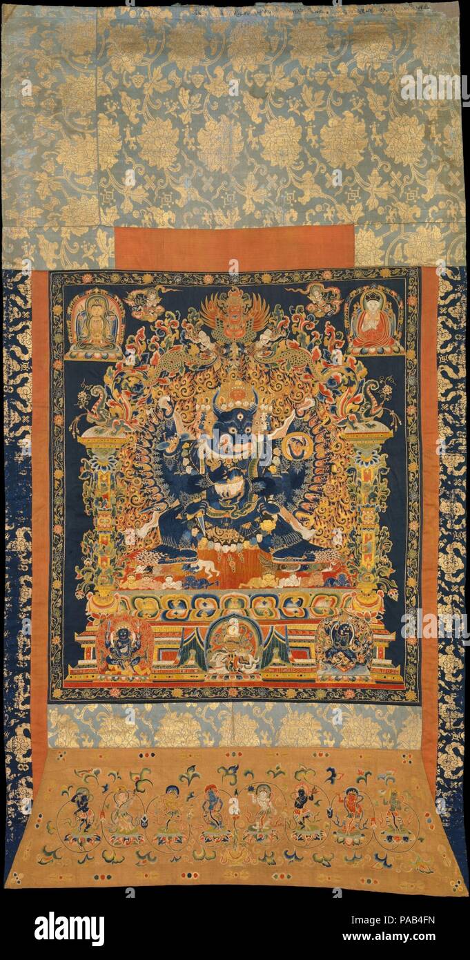 Vajrabhairava. Culture: China. Dimensions: 57 1/2 x 30 in. (146.1 x 76.2 cm)  Mount (including backboard and bonnet): 63 1/4 × 34 9/16 × 3 5/8 in. (160.7 × 87.8 × 9.2 cm). Date: early 15th century.  The powerful protective deity Vajrabhairava became important in Tibet and ultimately played an role in Buddhist practice at the Chinese court. In the upper right hand corner is almost certainly the Gelugpa lama Shakya Ye shes, who visited the court of the Ming Yongle-period emperor Chengzu, when he conducted Vajrayana rituals in 1415-16. In conjunction with Shaka Ye shes's return to Tibet, where he Stock Photo