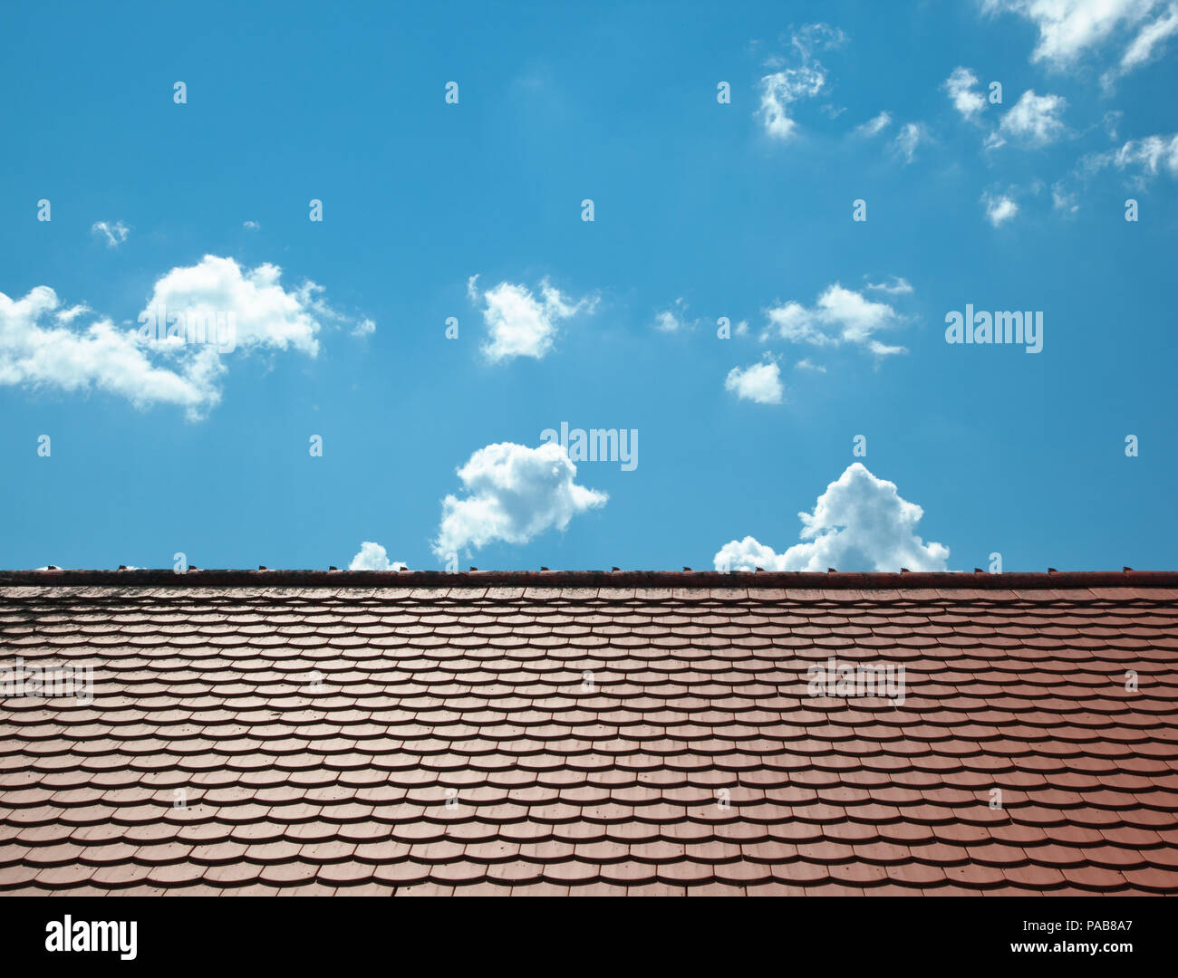 A photography of a roof and a blue sky Stock Photo - Alamy