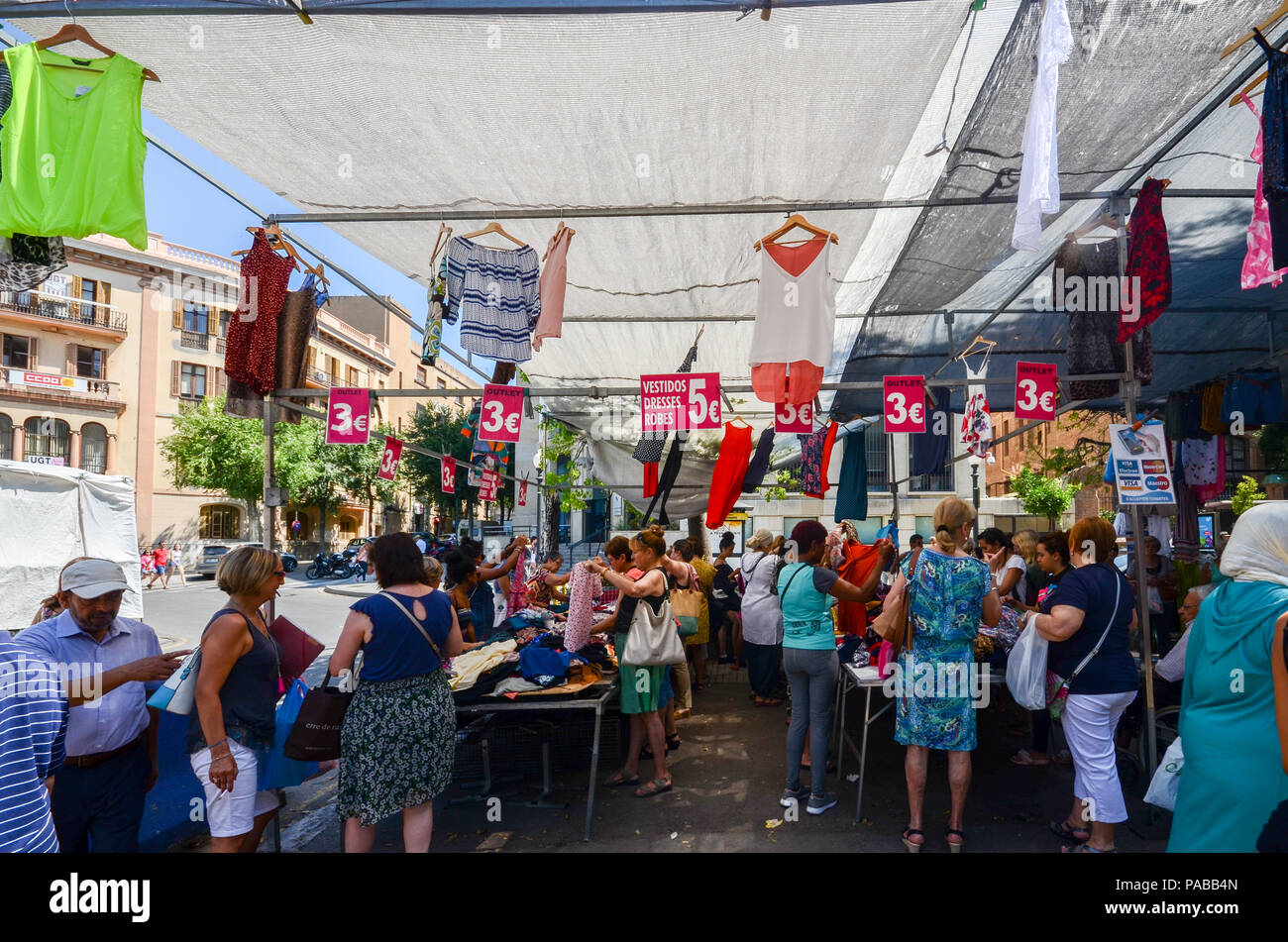 Tarragona, Spain July 12, 2018 Shoppers at street market outlet on