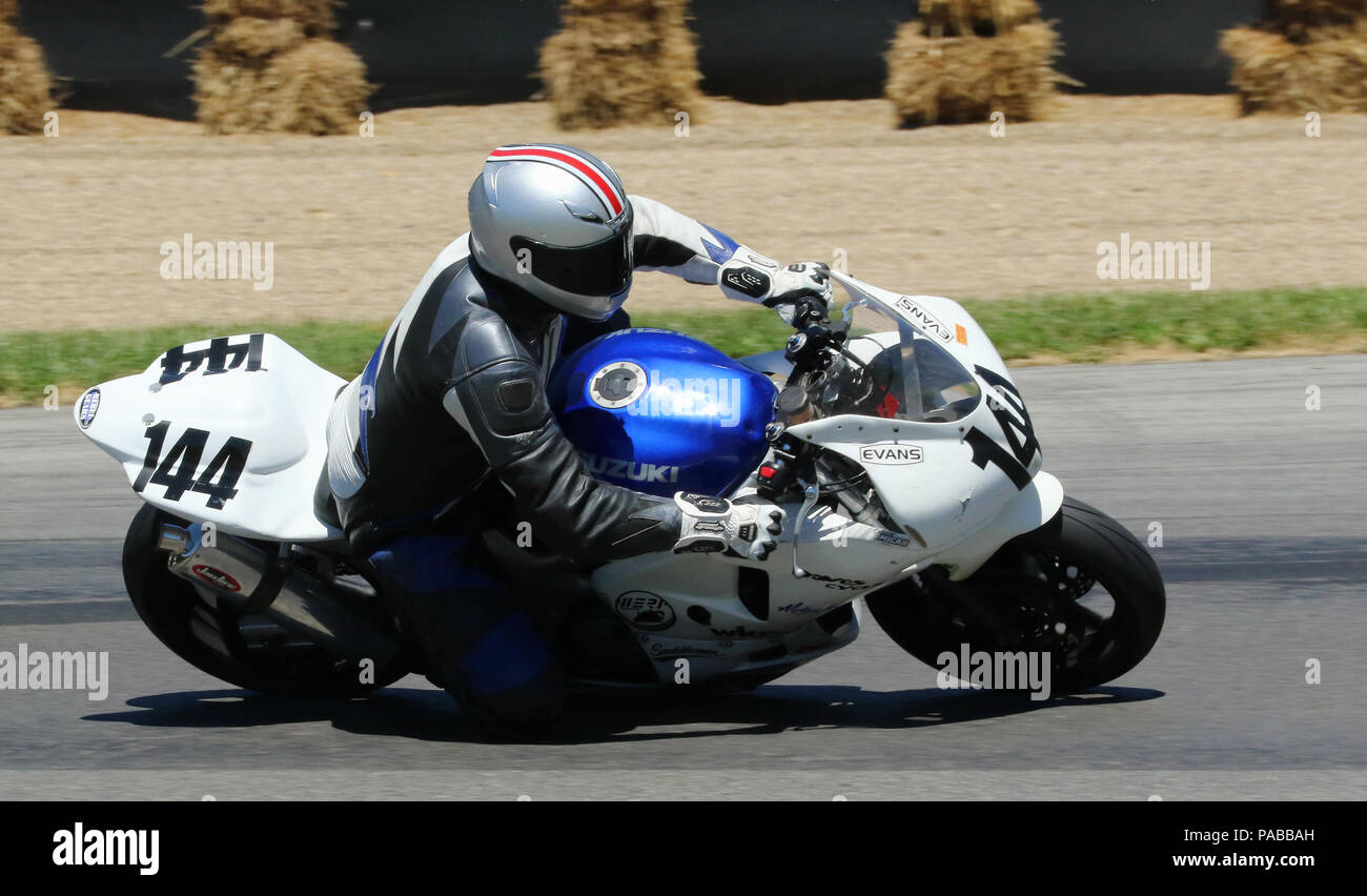 Motorcycle 144 with logos including Evans, Suzuki. American Motorcycle Association Vintage
