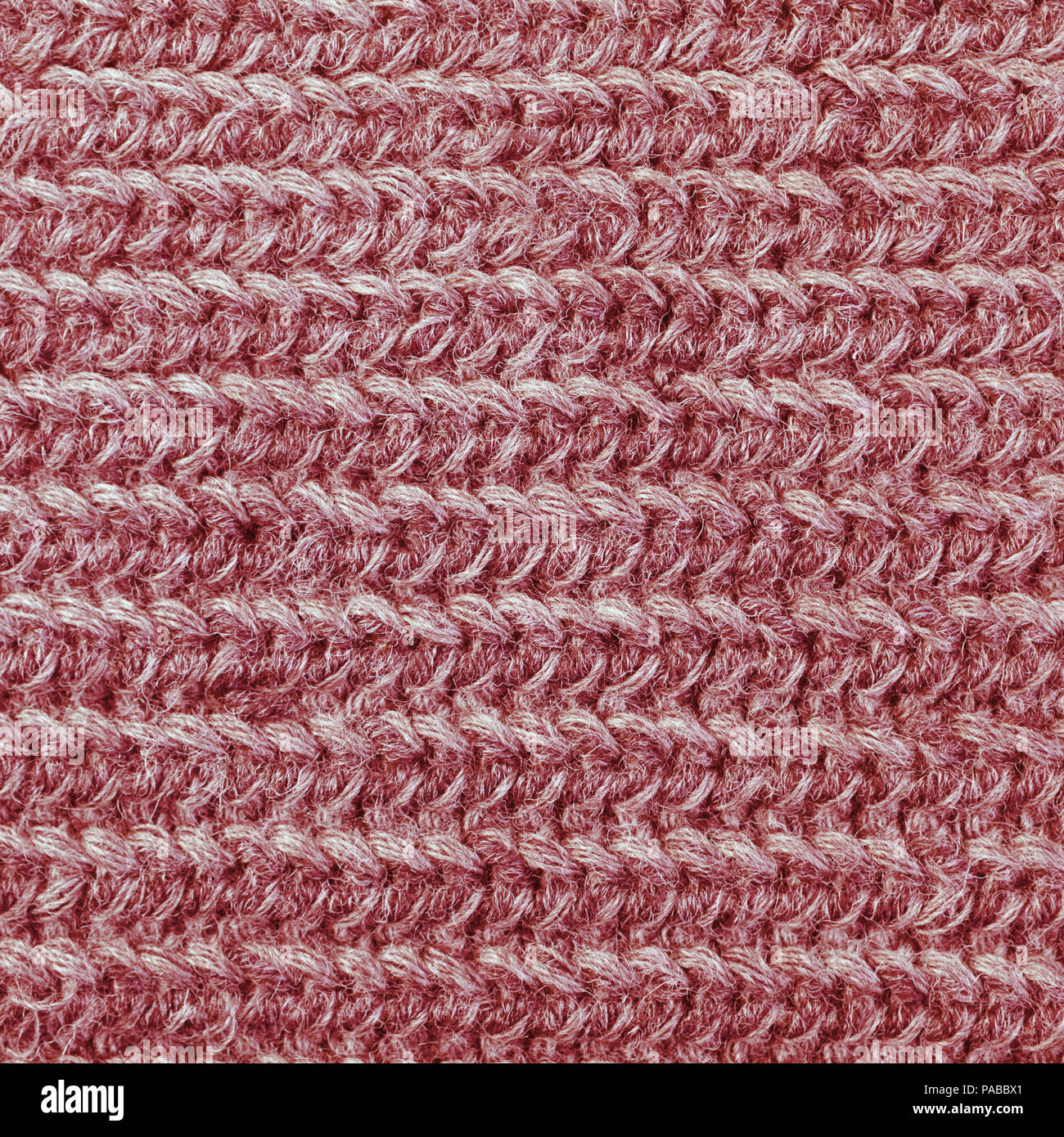 Large knitted red knitwear texture closeup Stock Photo