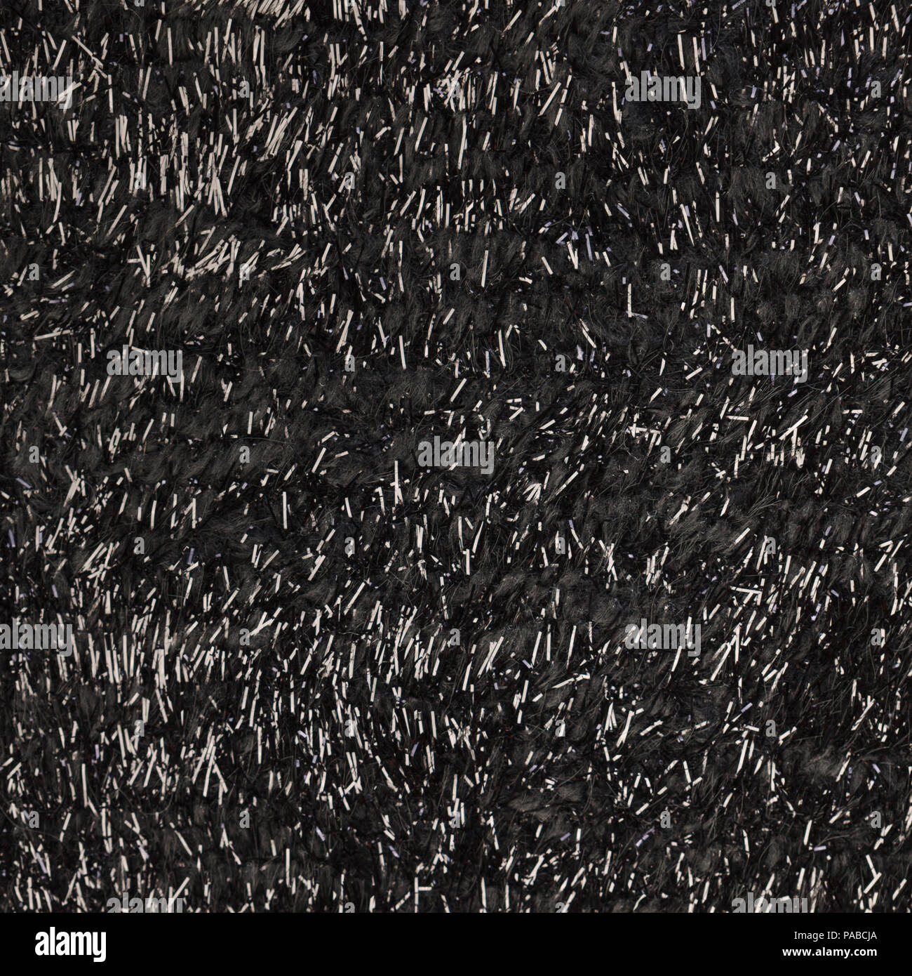 Black nappy jacquard wool fabric with shiny fiber texture closeup Stock Photo