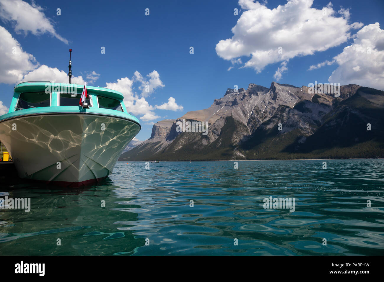 Lake Minnewanka during a vibrant sunny summer day Taken in Banff Lake Minnewanka during a vibrant sunny summer day Taken in Banff