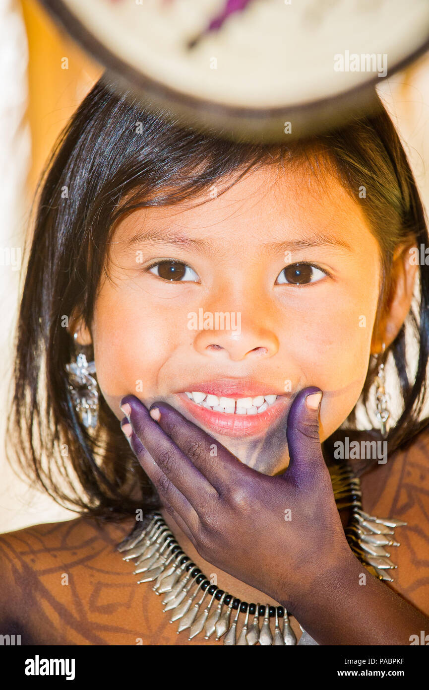 EMBERA VILLAGE, PANAMA, JANUARY 9, 2012: Portrait of an unidentified native Indian girl with bone bead and black paint on her face in Panama, Jan 9, 2 Stock Photo