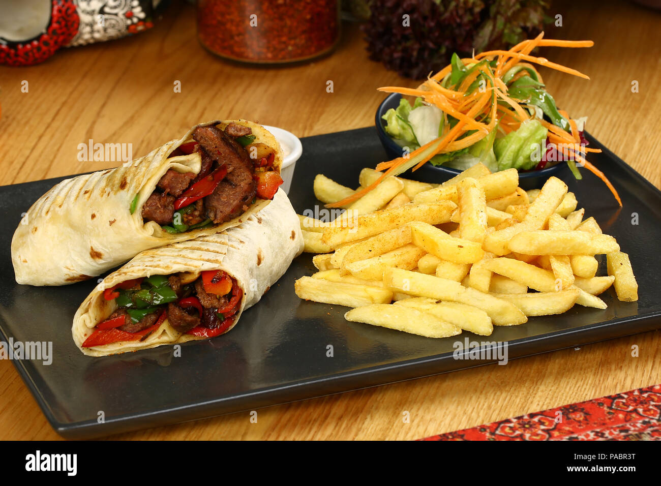 Tortilla wrap with beef meat and french fries Stock Photo - Alamy