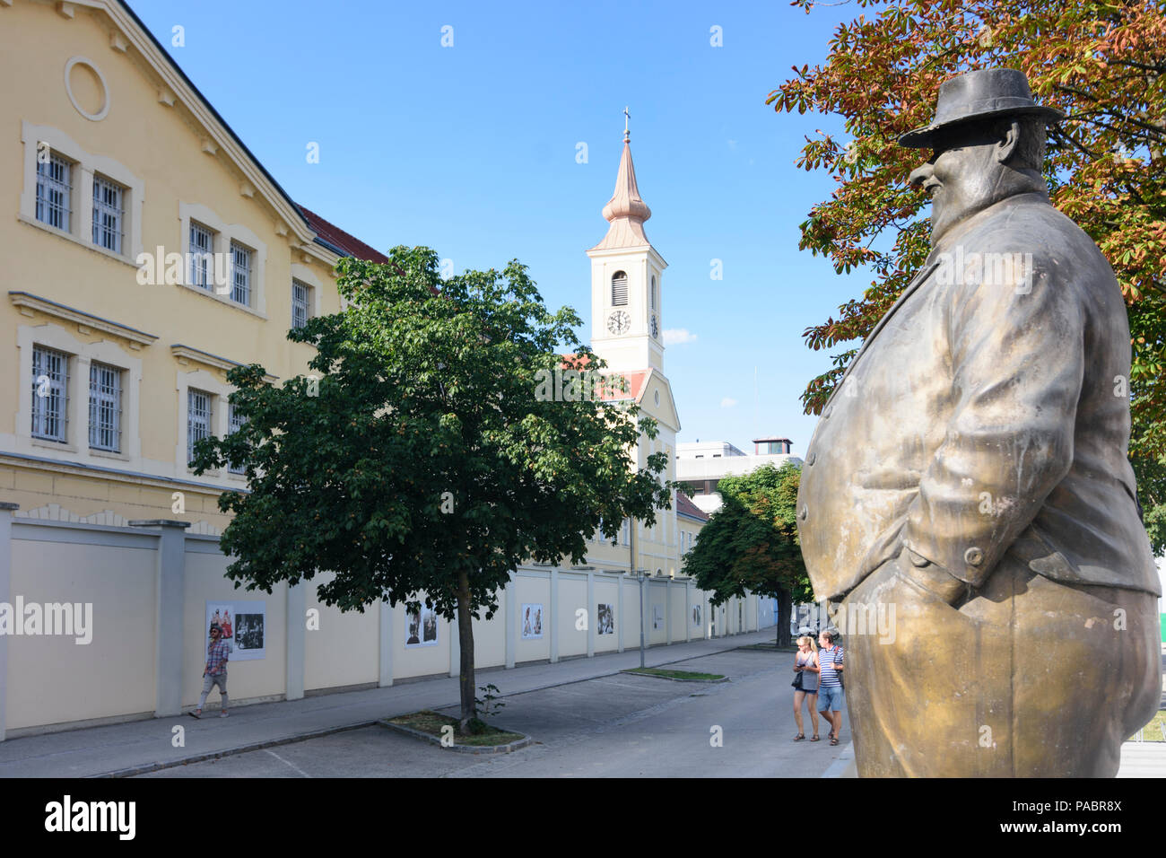 Krems an der Donau: statue in front of Karikatur Museum (Cartoon museum) looks to Justizanstalt (jail) in district Stein in Austria, Niederösterreich, Stock Photo