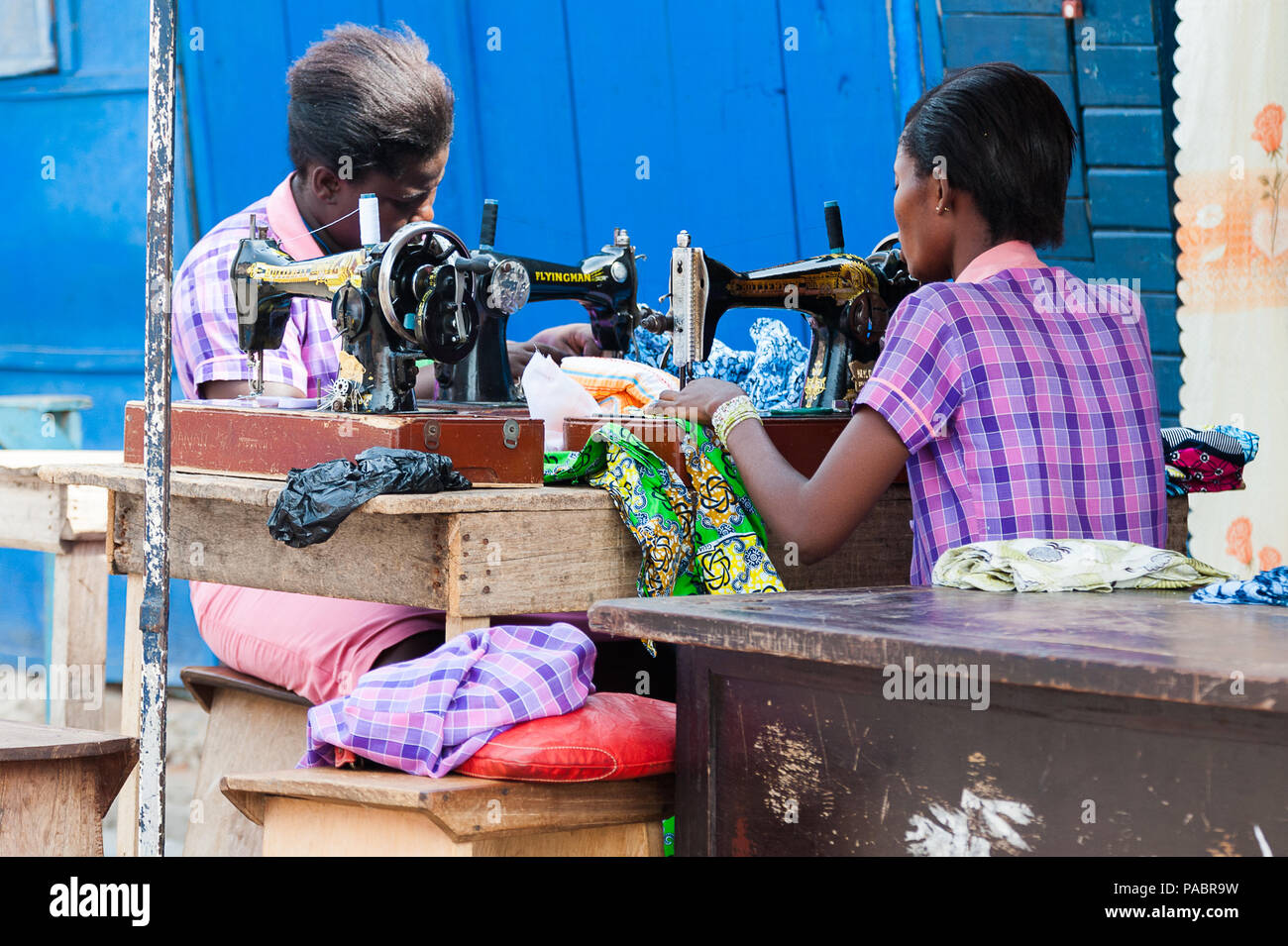 GHANA MARCH 2, 2012 Unindentified Ghanaian woman works with a sewing