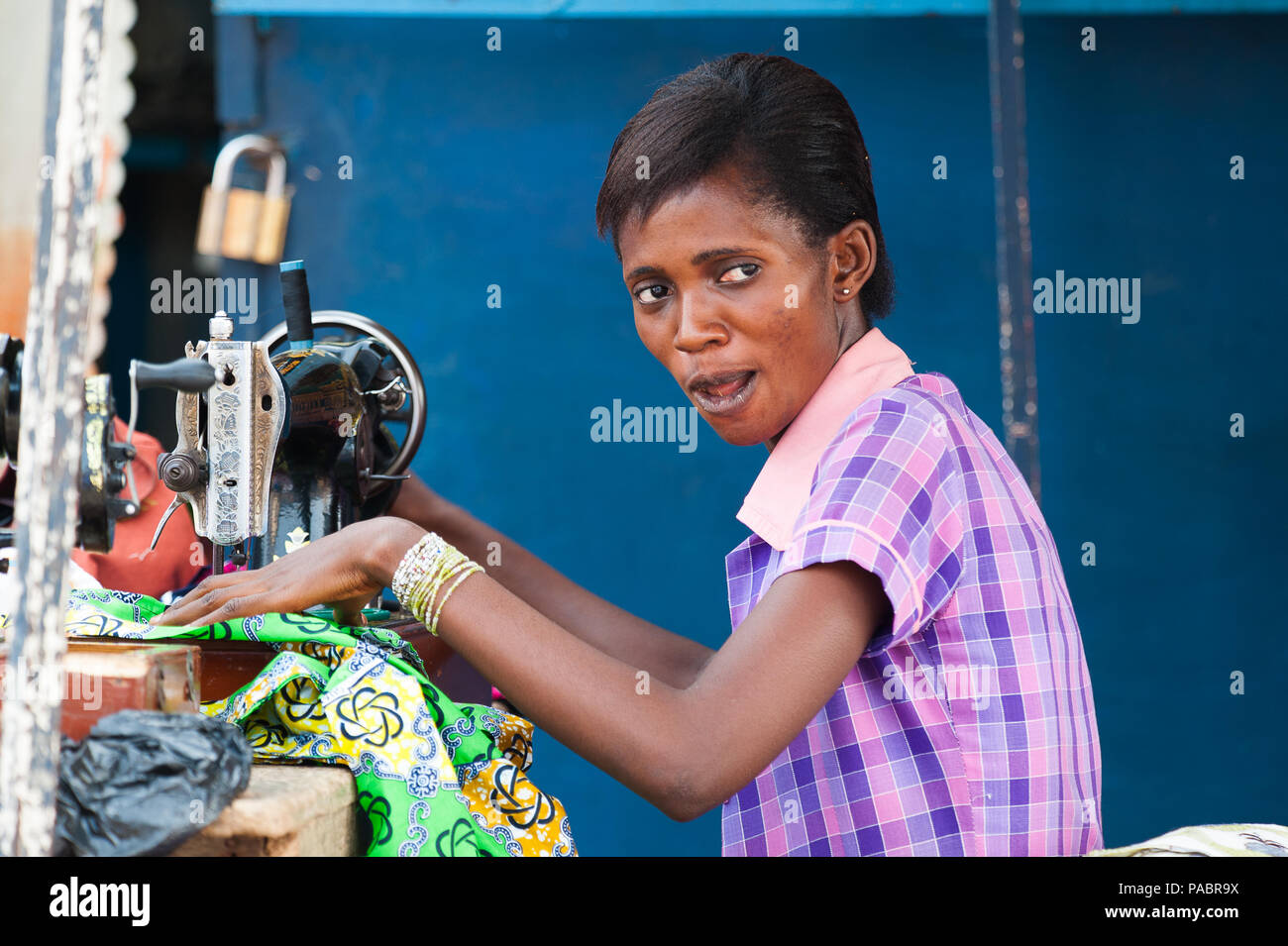 GHANA MARCH 2, 2012 Unindentified Ghanaian woman works with a sewing