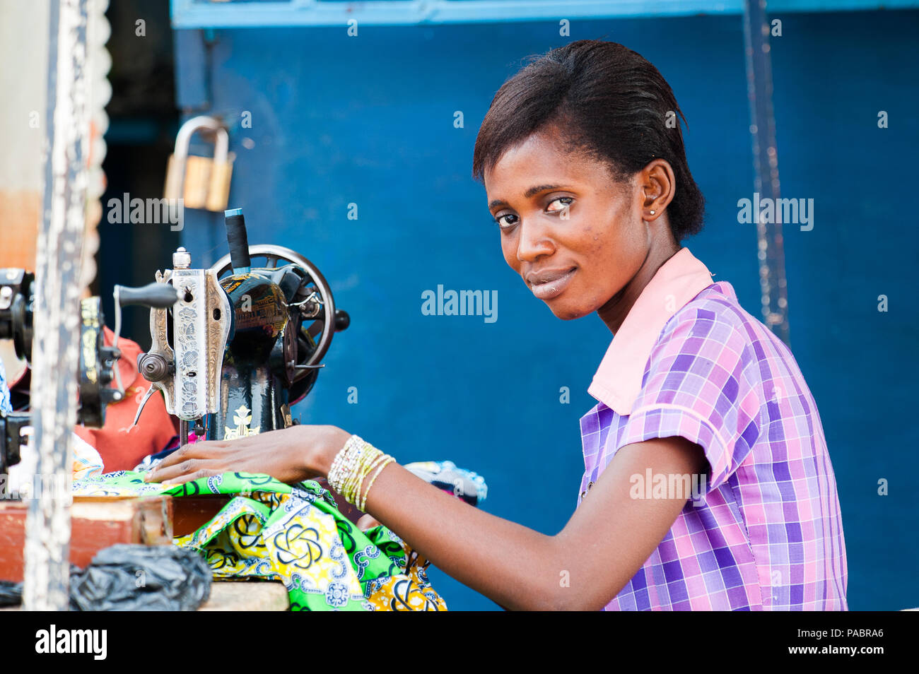 GHANA MARCH 2, 2012 Unindentified Ghanaian woman works with a sewing